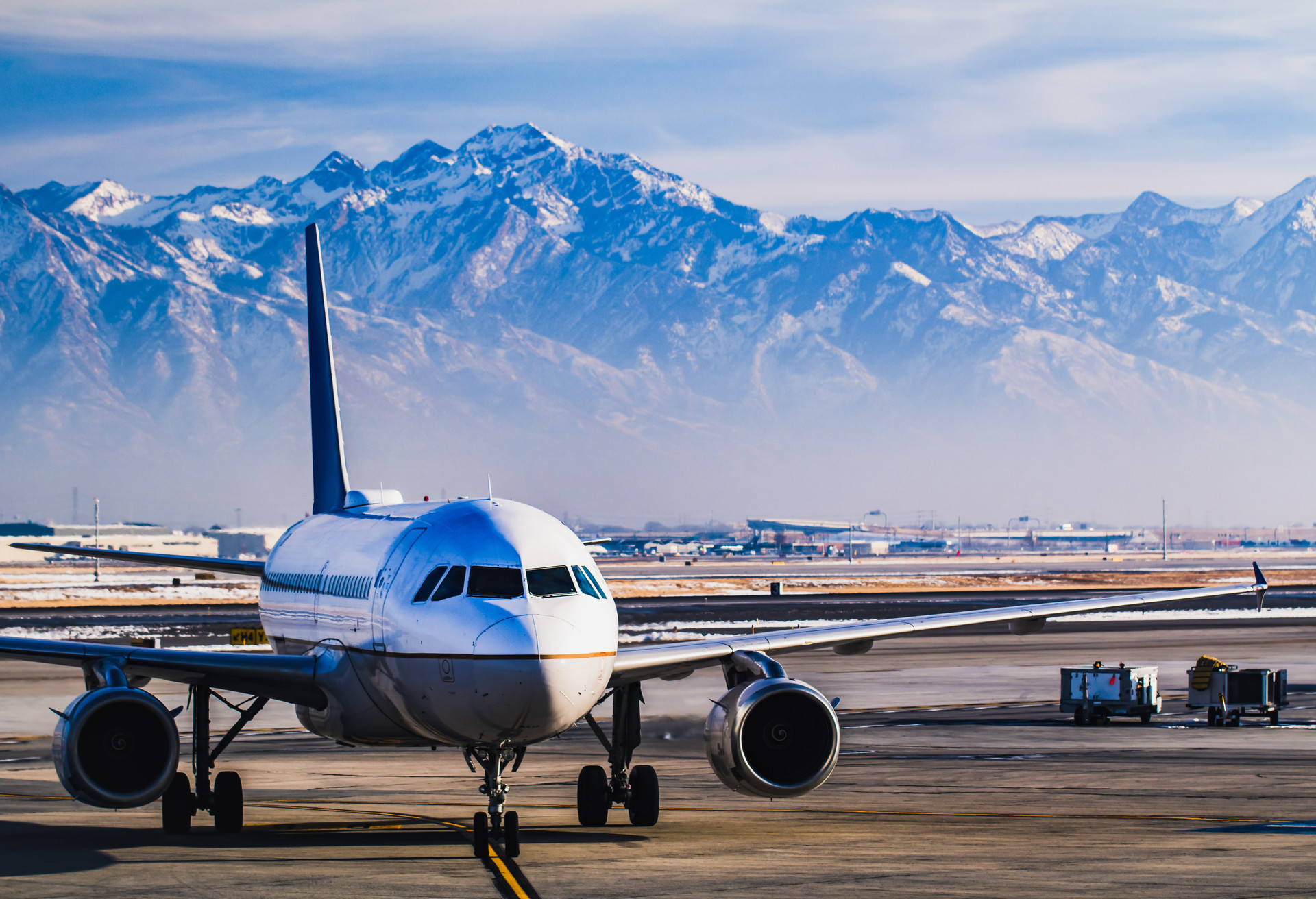 Beautiful view of the snow covered mountains from Salt Lake City whilst in the airport lounge getting ready for departure during winter.  ; Shutterstock ID 1011872626