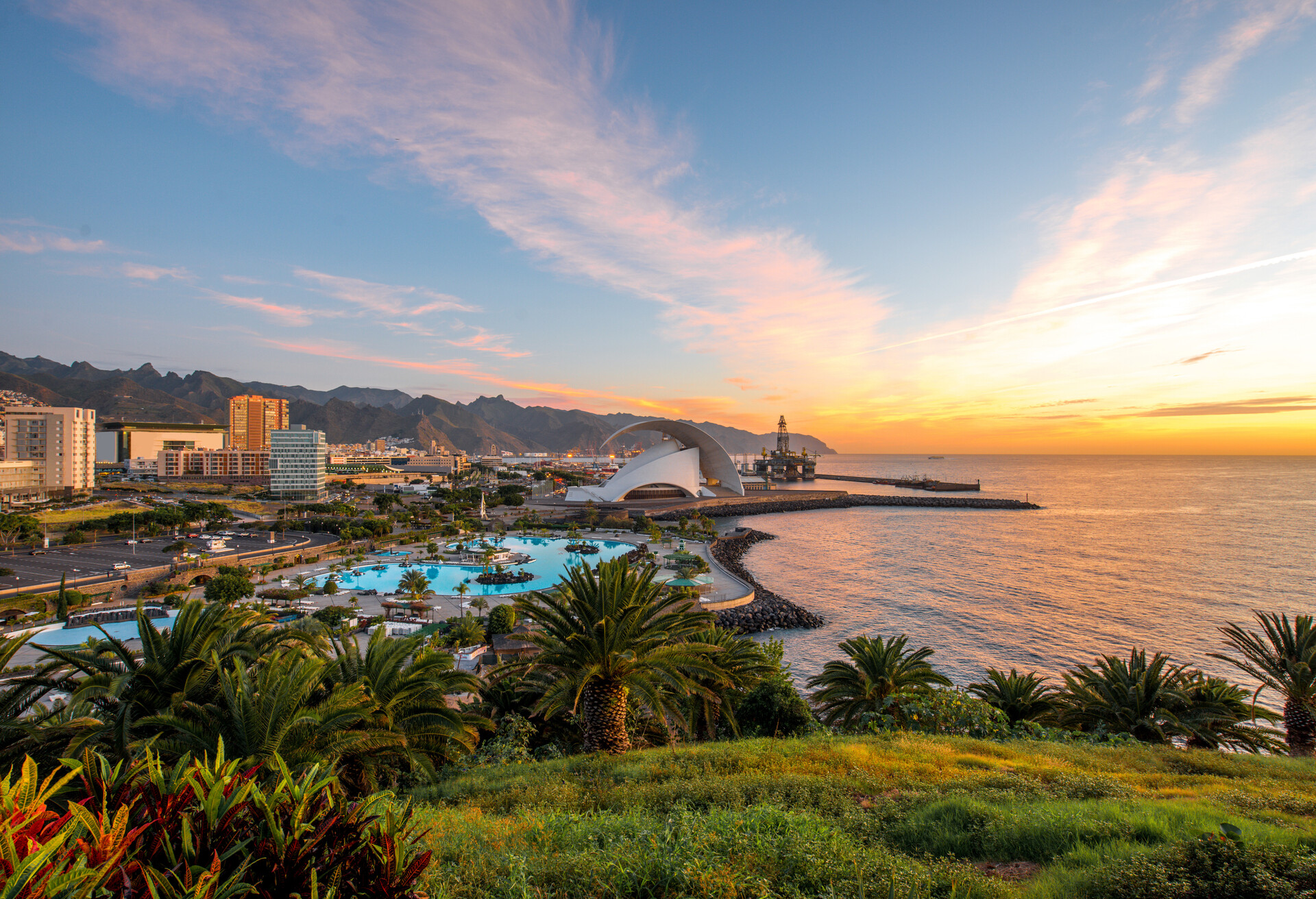 Santa Cruz cityscape view with park, ocean and mountains on the background on the sunrise, Canary islands, Spain  ; Shutterstock ID 362881445; Purpose: Destiny; Brand (KAYAK, Momondo, Any): Any