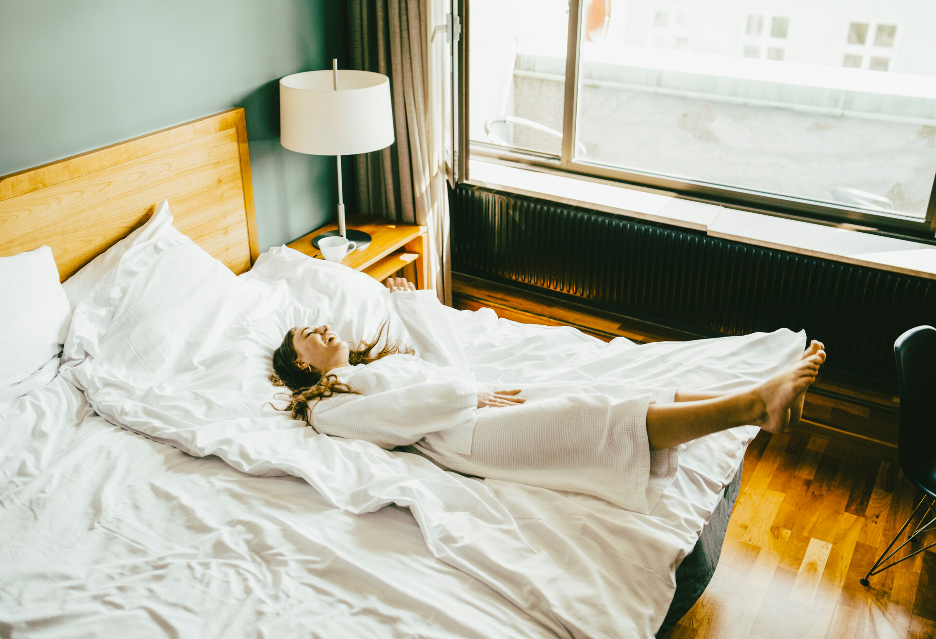 Girl in a hotel bed