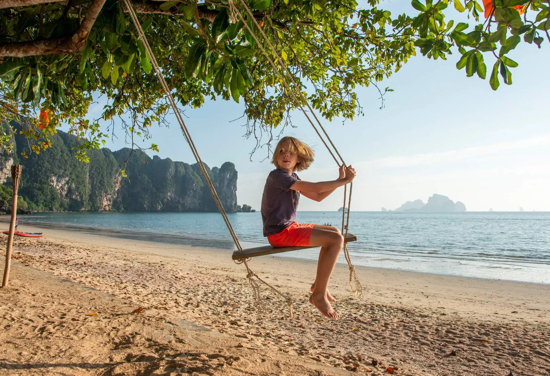 DEST_THAILAND_KRABI_AO_NANG_BEACH_BOY_KID_SEA_GettyImages-1363493073-1.jpg