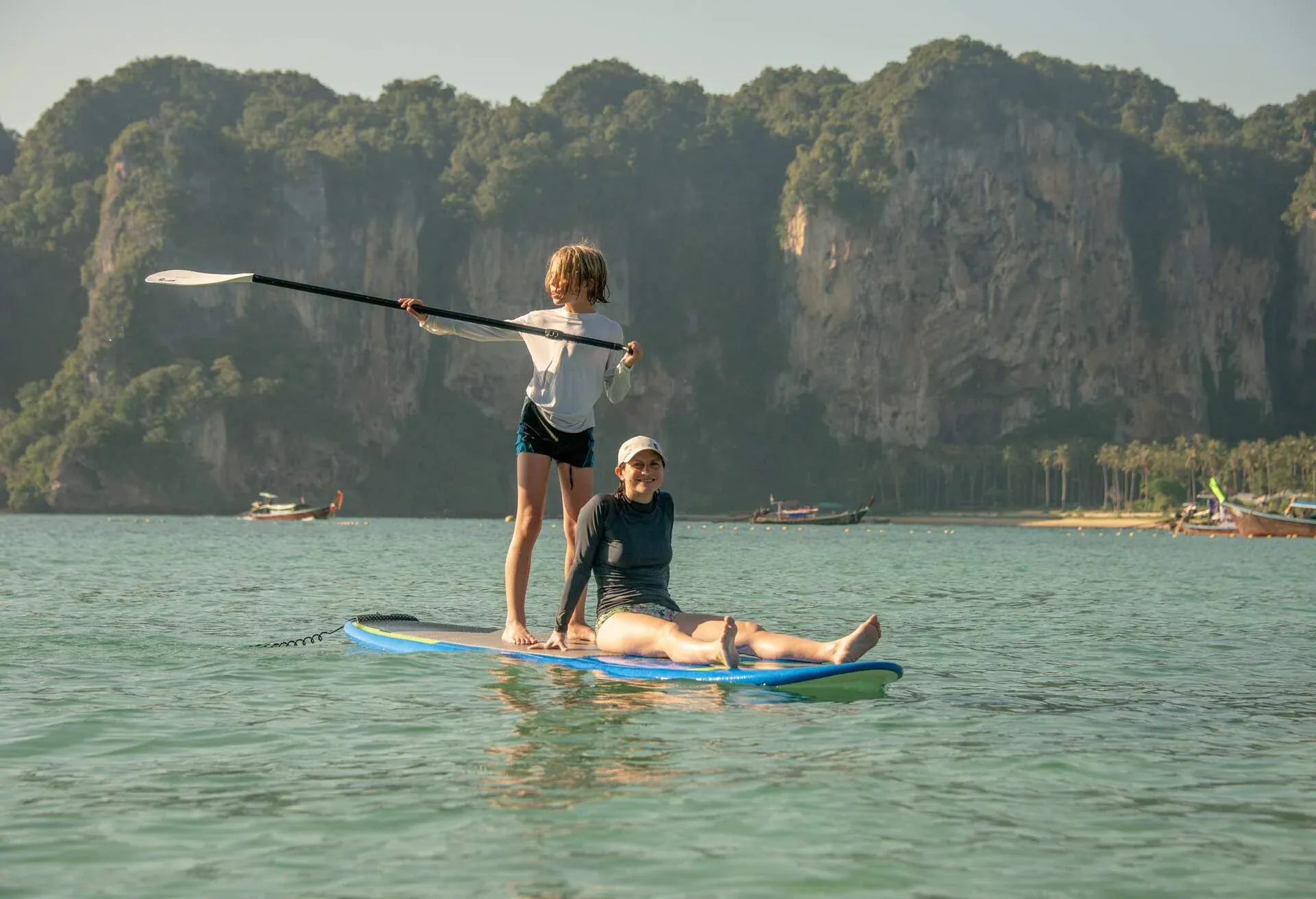DEST_THAILAND_KRABI_AO_NANG_RAILAY_BEACH_KID_WOMAN_PADDELING_PADDLEBOARD_GettyImages-1363493271.jpg