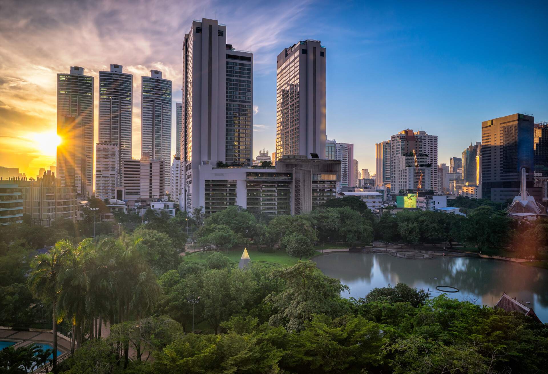 Sunset scence of Bangkok Panorama ,Aerial view of Bangkok modern office buildings and condominium in Bangkok city downtown with sunset sky and clouds at Bangkok , Thailand. Benjasiri Park