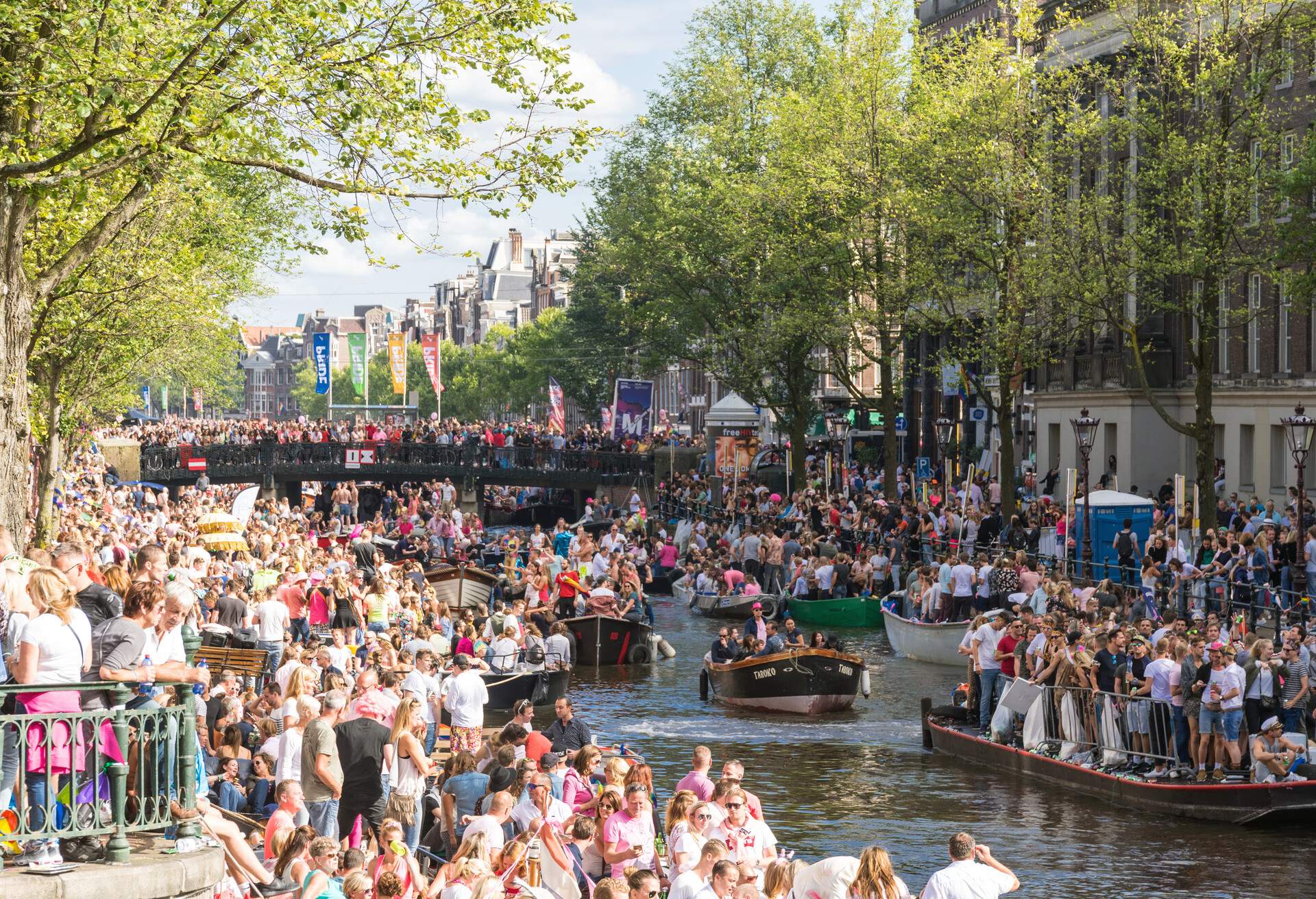 Amsterdam, August 05, 2017: Each year, in early August the gay pride parade takes place in the canal of Amsterdam. It is a large celebration for the rights of gay people. The canals are full of boats and a party mood can be felt in the whole town.