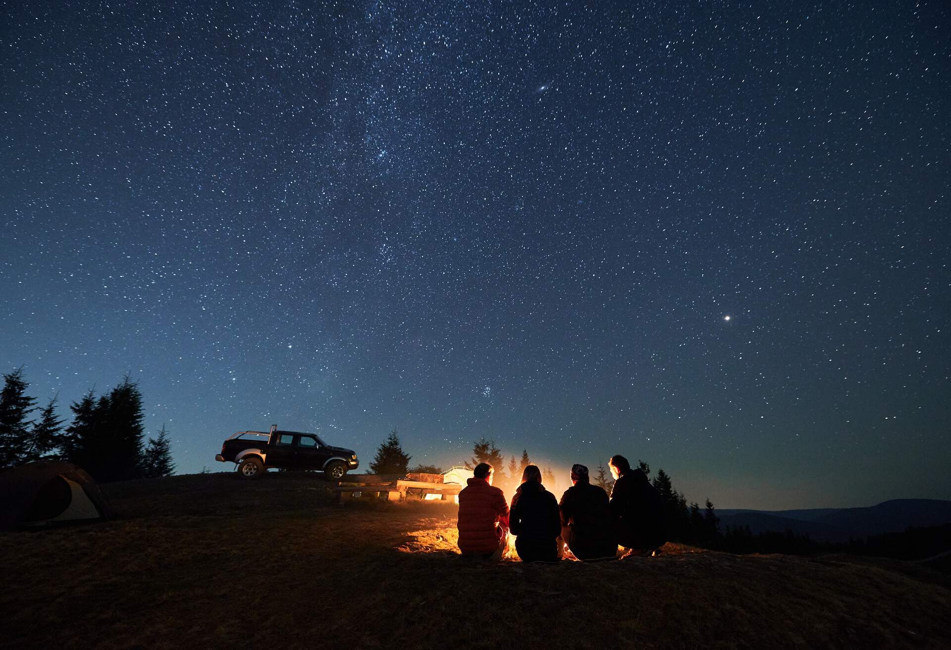 THEME_CAMPING_PEOPLE_FRIENDS_STARGAZING_NIGHT_GettyImages-1312962924