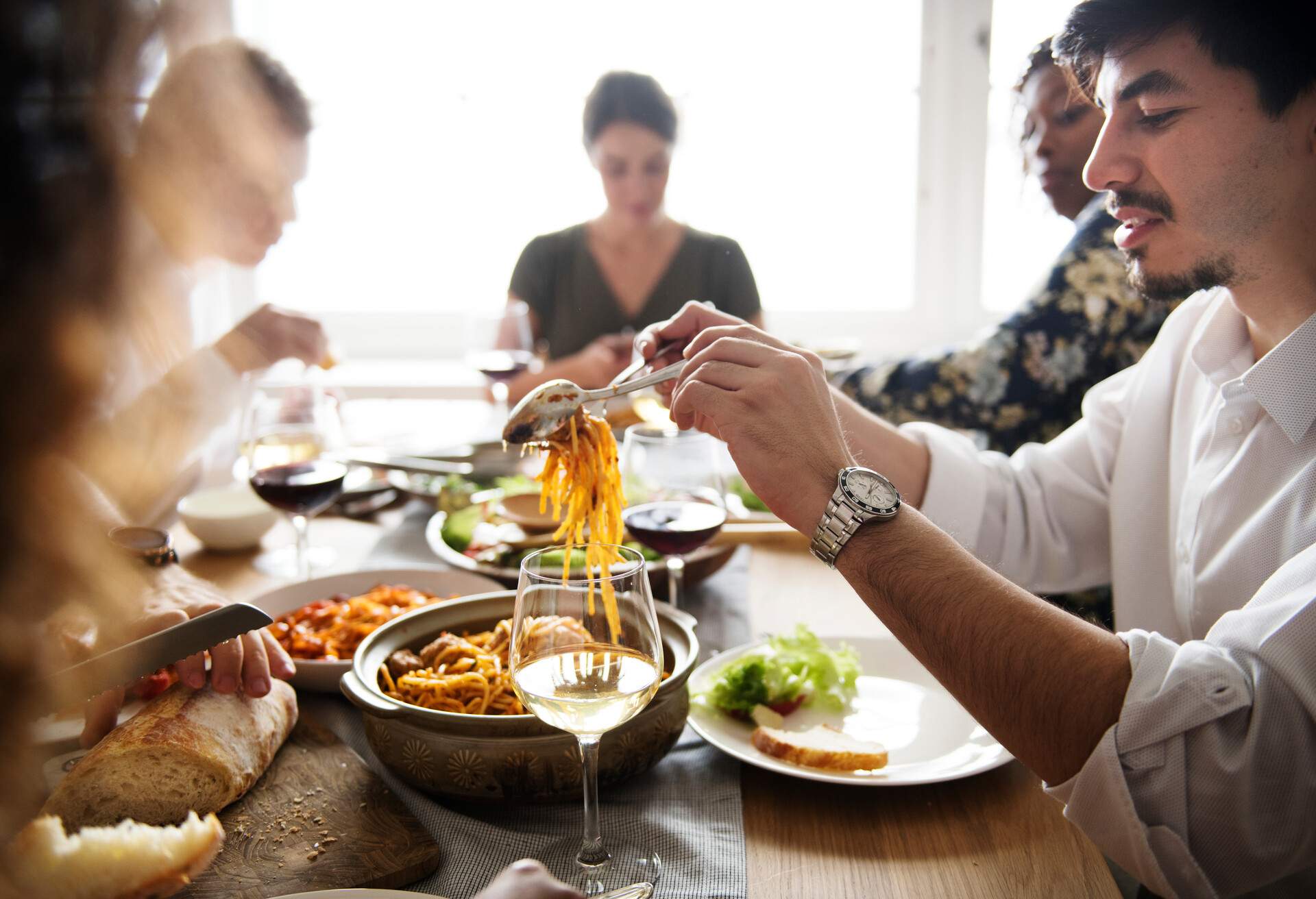 Friends gathering having Italian food together; Shutterstock ID 1067607518; Purpose: Content; Brand (KAYAK, Momondo, Any): Momondo