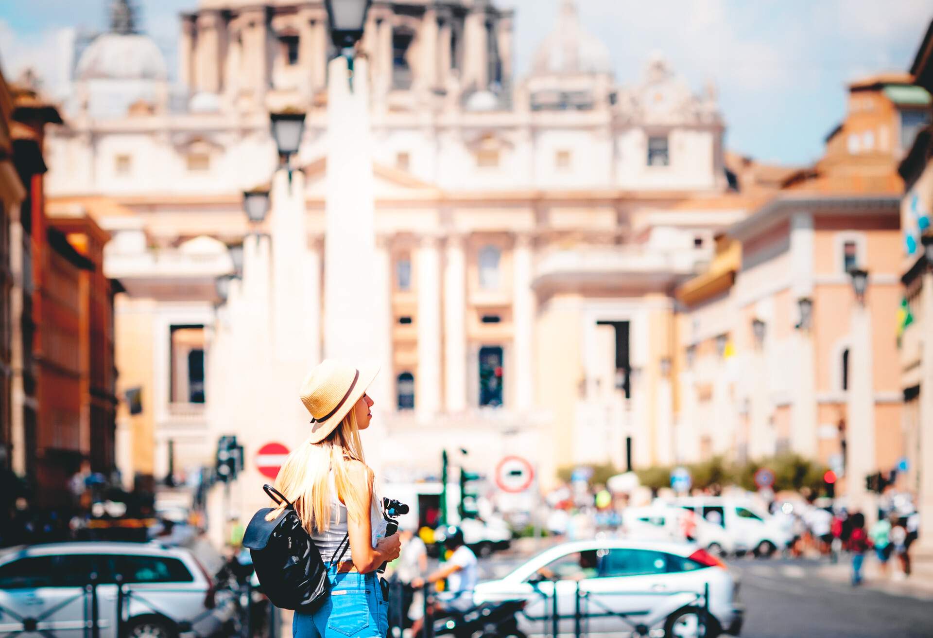Rome Europe Italia travel summer tourism holiday vacation background -young smiling girl with mobile phone camera and map in hand standing on the hill looking on the cathedral Vatican; Shutterstock ID 1503954503
