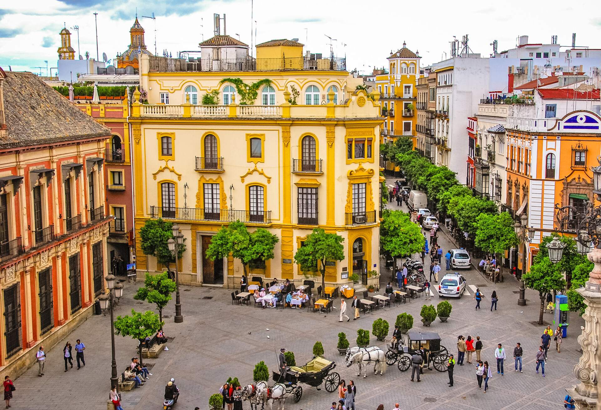 Plaza Del Triunfo in Seville, Spain with rooftops and the Santa Cruz church in the distance. Taken from the "La Giralda" bell tower in the Cathedral of Seville.