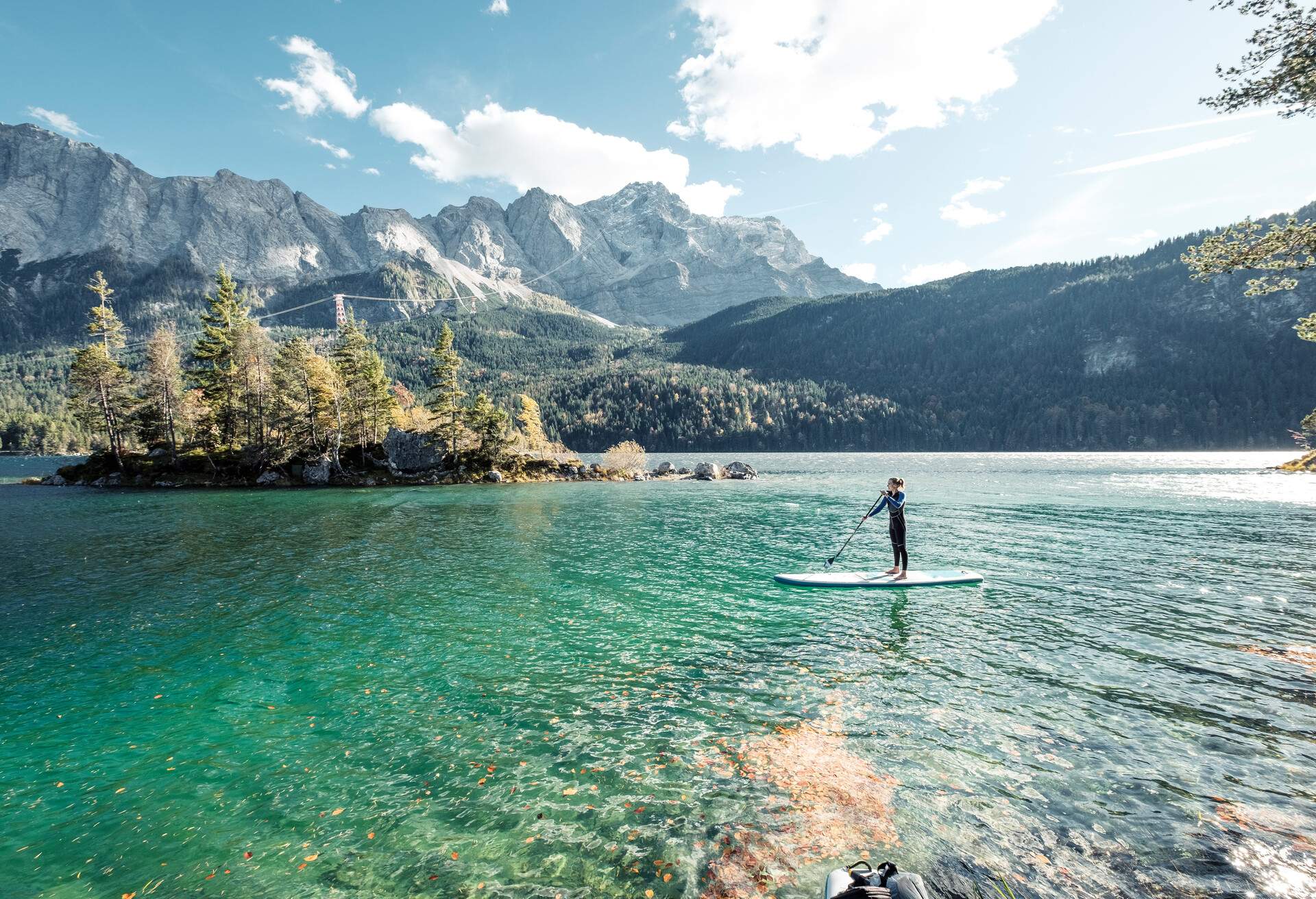 DEST_GERMANY_BAVARIA_GARMISCH_EIBSEE-LAKE_THEME_SUP_PADDLEBOARDING_GettyImages-1308858280
