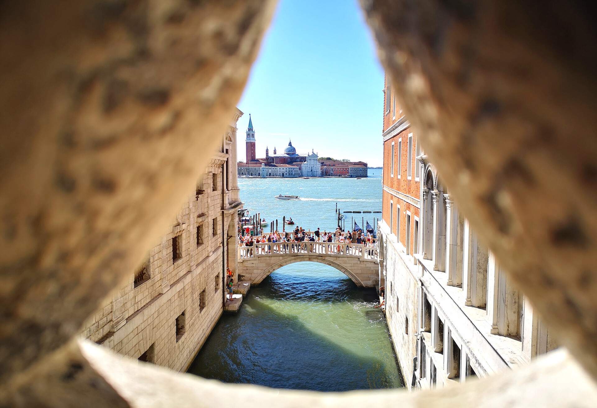 View of Venice and San Giorgio Island through Sigh Bridge on a sunny day