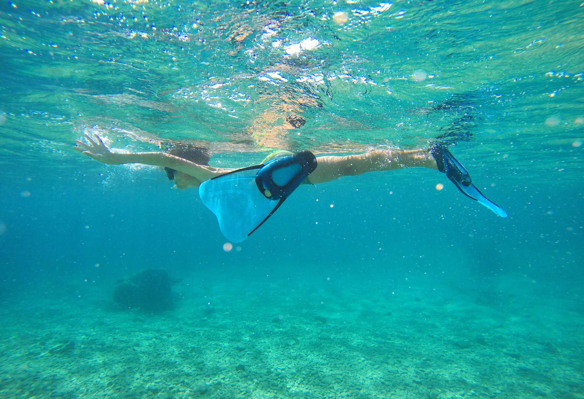 Boy snorkeling in Adriatic Sea by the Dugi Otok island in Croatia.