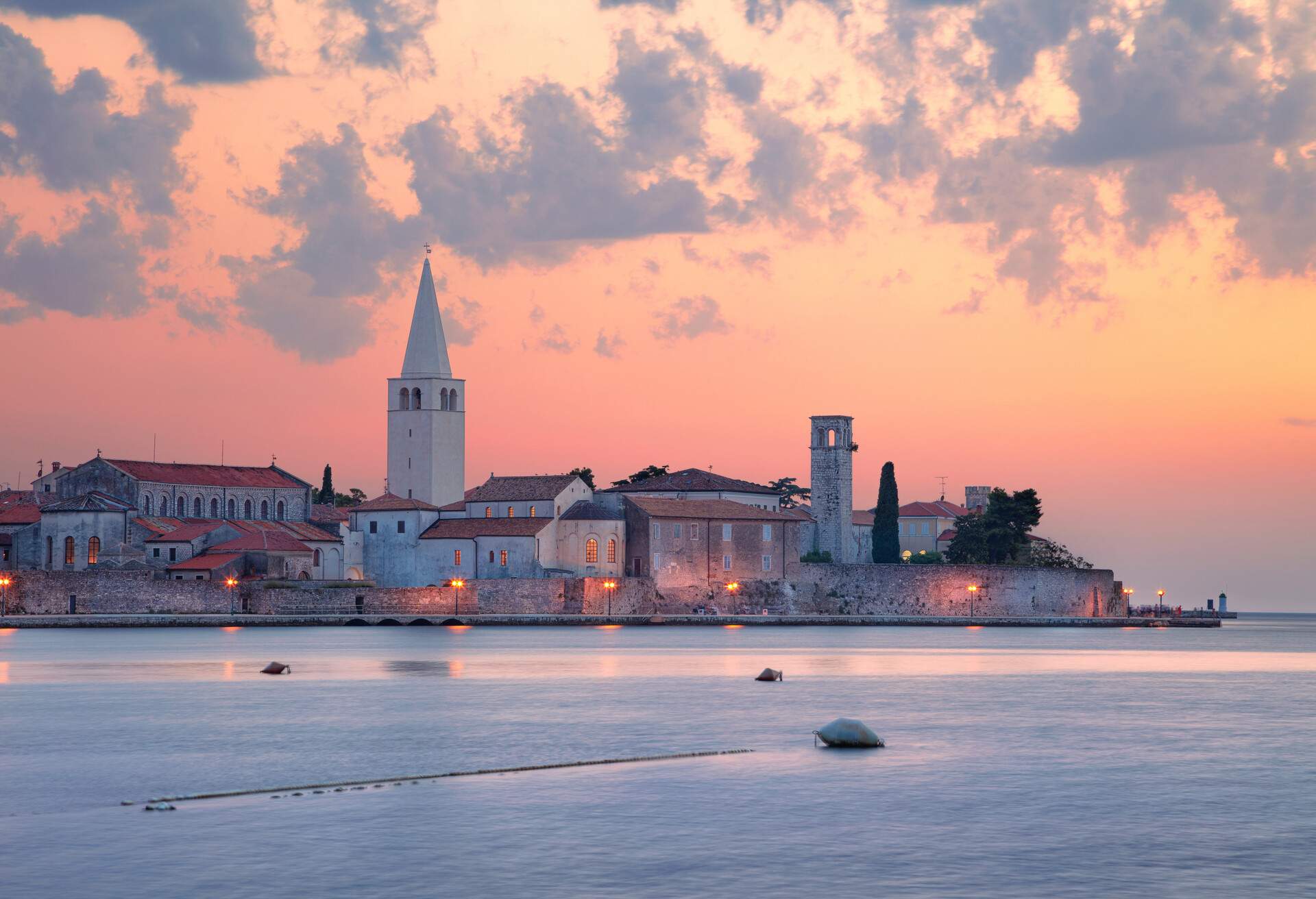 Cityscape image of Porec, Croatia with the Euphrasian Basilica located on Istrian Peninsula at summer sunset.