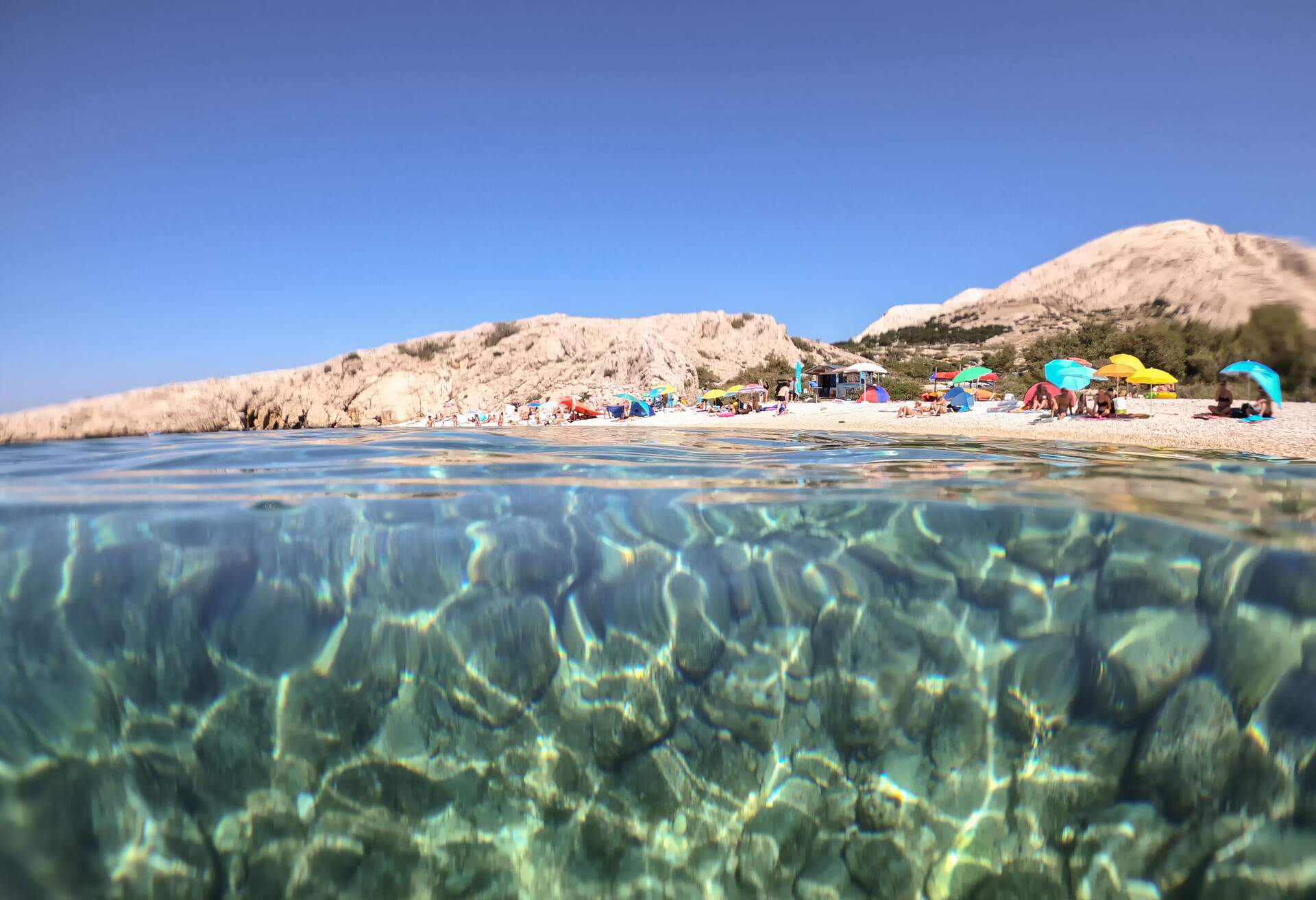 Beach Zala is located in place Stara Baška (Krk) and it is one of the most famous beaches in Croatia