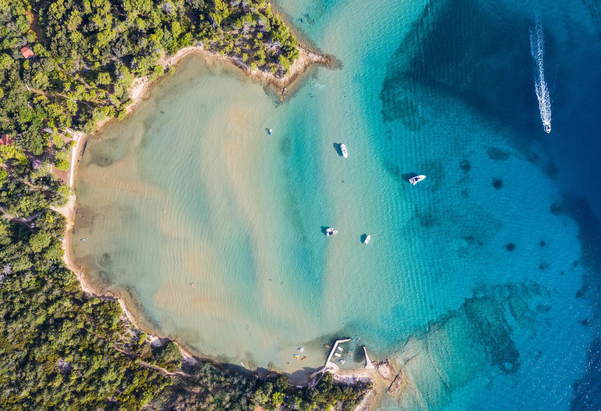 Top down viewf of an idyllic bay and beach in the Rab island by the Adriatic sea in Croatia