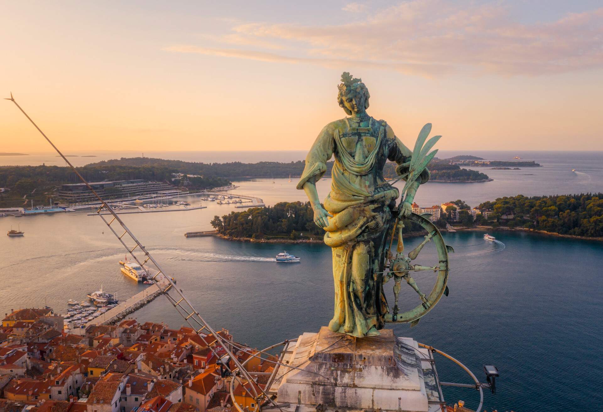 Close-up aerial view of statue of Saint Euphemia (15th century) on top of bell tower in old town Rovinj, Istria, Croatiaj