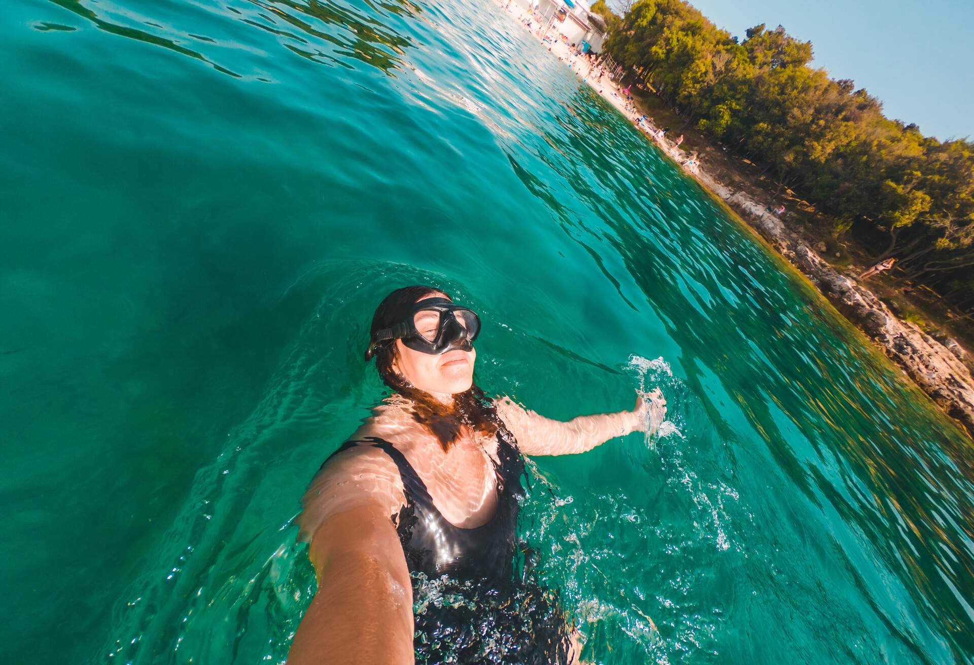 young pretty smiling woman taking selfie in snorkeling mask summer sea activities summer beach vacation