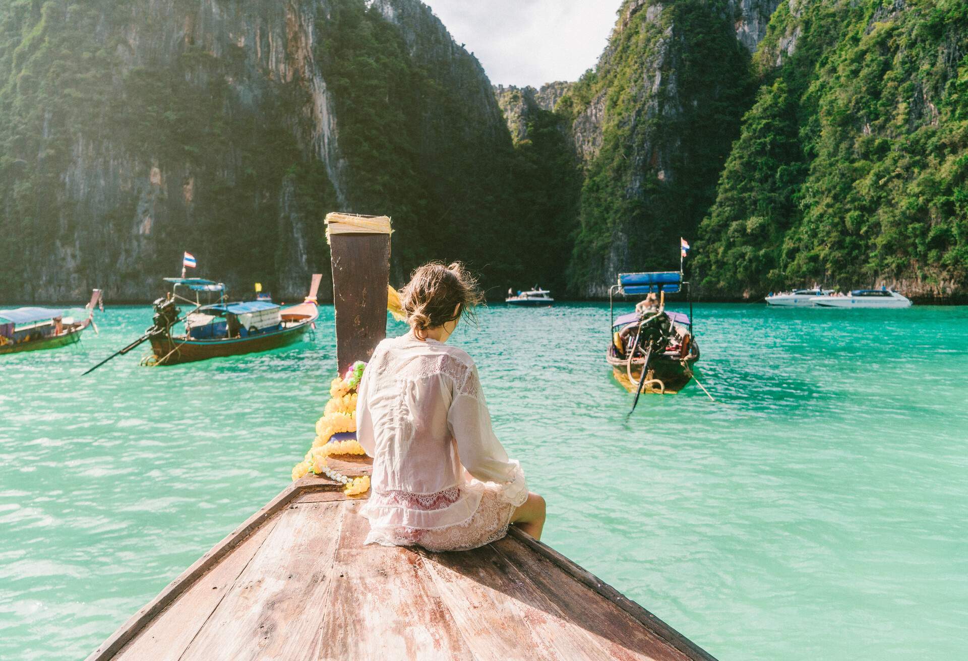 Young Caucasian woman in Thai Taxi boat in  Krabi, Thailand