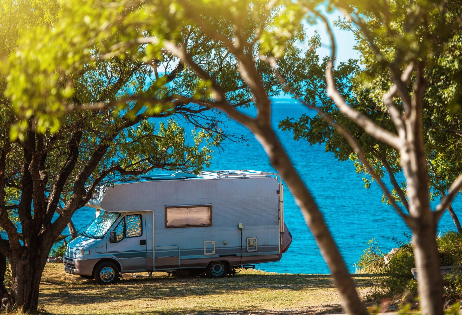 Sea Front RV Camping Spot. Summer Recreational Vehicle Camper Van Road Trip. Croatian Landscape.