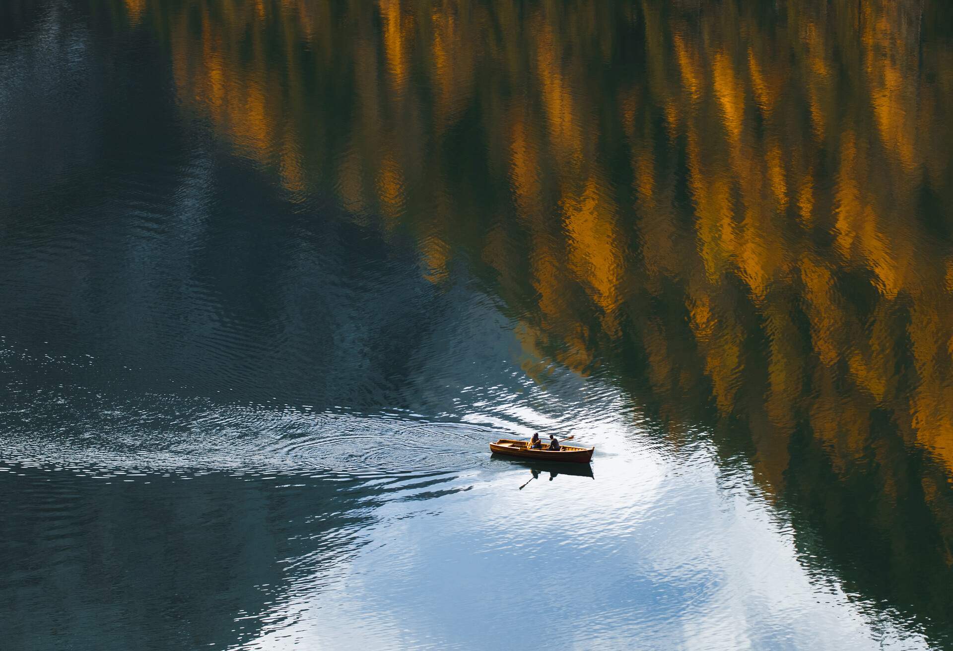 Abstract natural background with room for copy space, amazing autumn landscape with mirror reflection in clear water surface from above. Natural pattern. Fall in mountains. Drone point of view. Tourist attraction and recreational pursuit. Travel in European Alps.