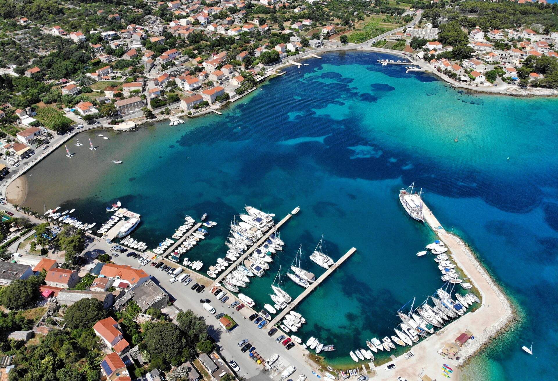 Lumbarda, Croatia - harbor aerial drone view.