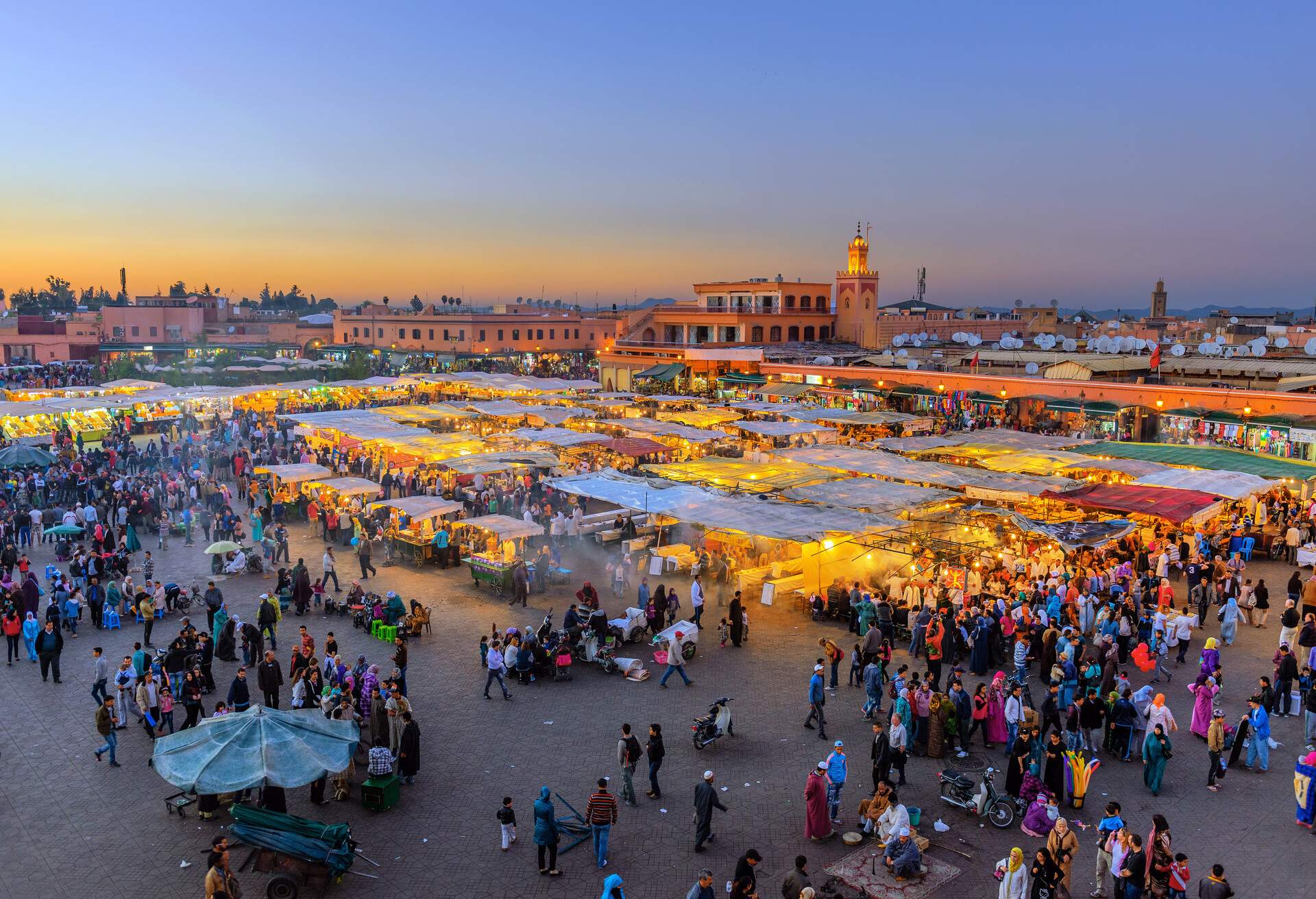 Famous Djemaa El Fna Square in early evening light, Marrakech, Morocco with the Koutoubia Mosque, Northern Africa.Nikon D3x