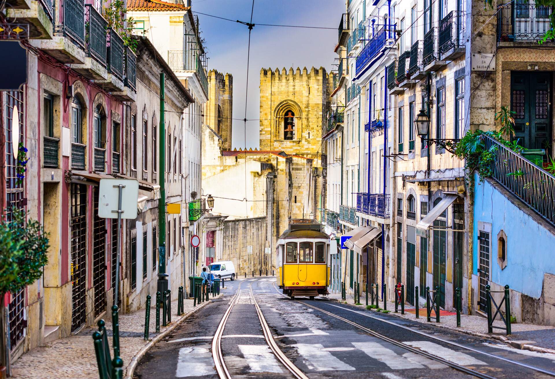 Lisbon, Porgugal cityscape and tram near Lisbon Cathedral.; Shutterstock ID 387371707; Purpose: IG Stories; Brand (KAYAK, Momondo, Any): KAYAK