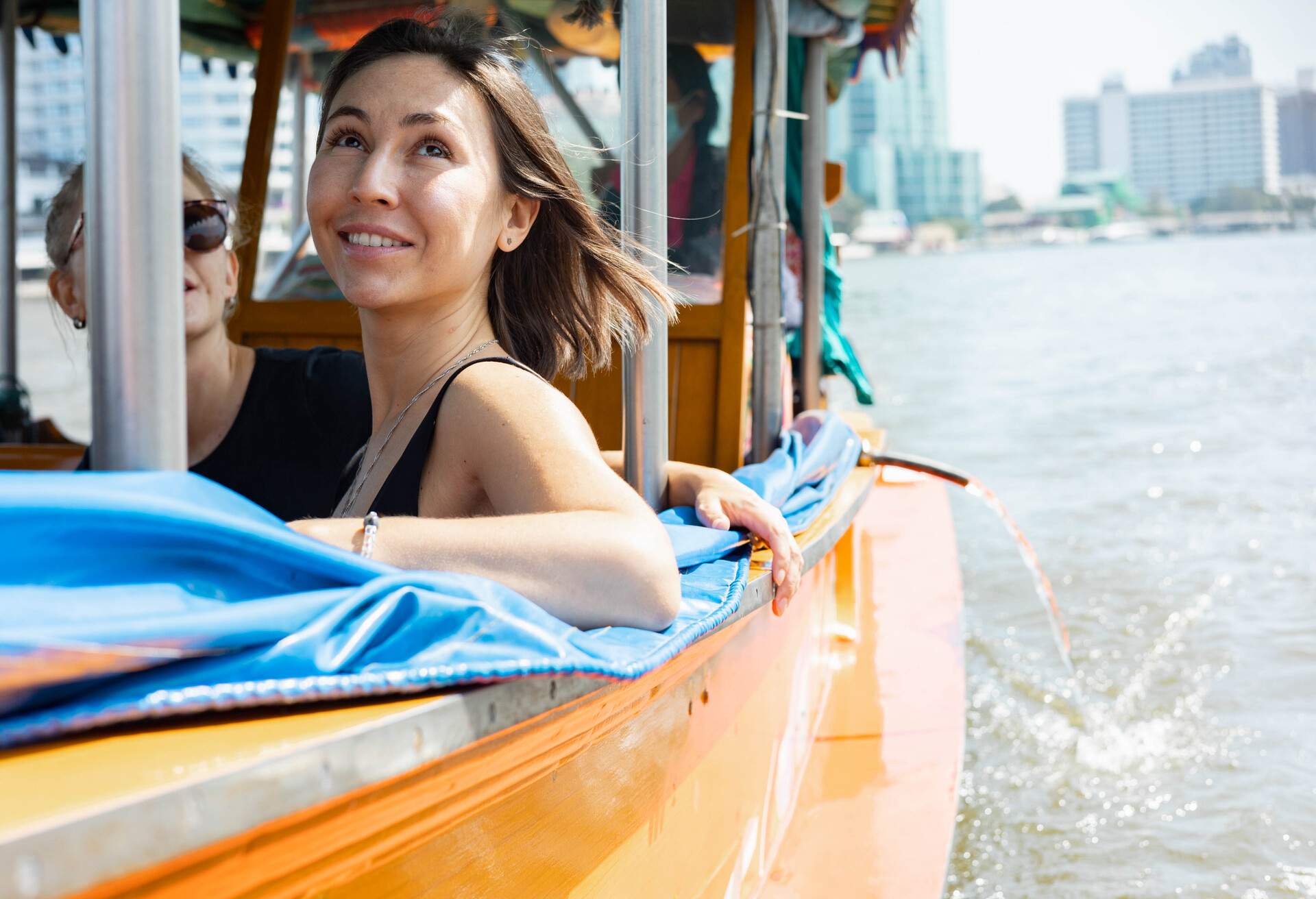 DEST_THAILAND_PEOPLE_WOMAN_BOAT_GettyImages-1393967503.jpg
