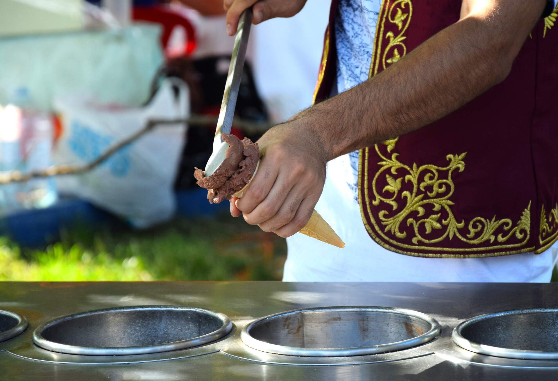 Preparation of Turkish ice cream. The man behind the work surface