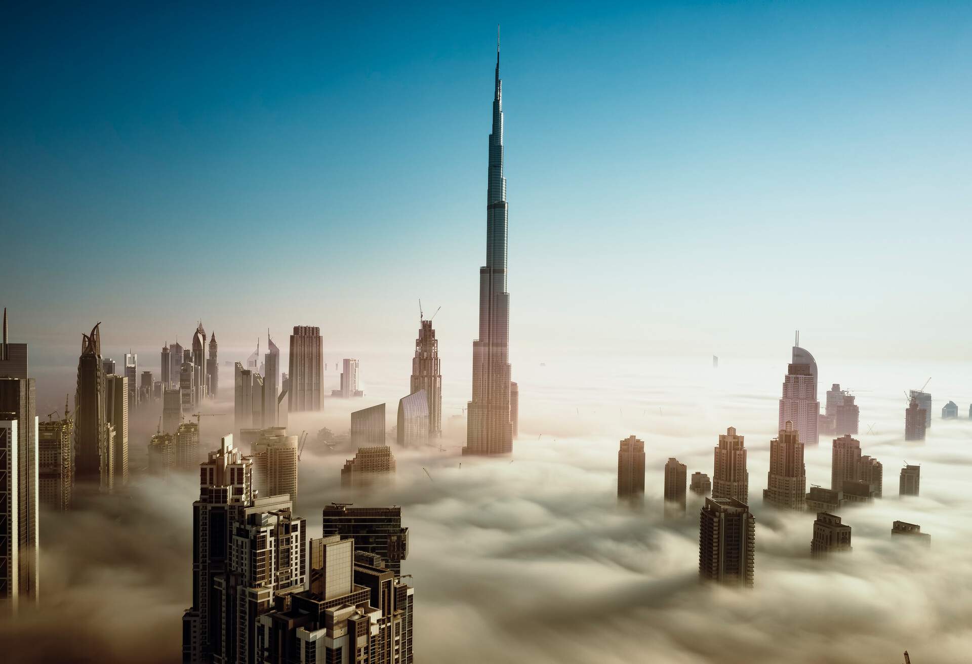 Dubai Downtown Skyline in early morning fog, United Arab Emirates