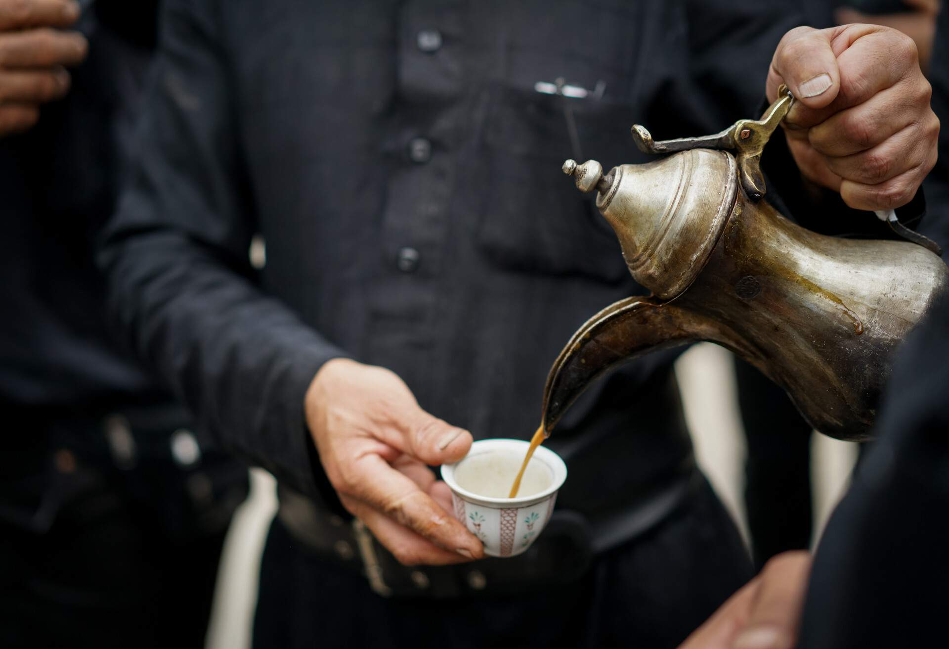 Having traditional Arabian coffee with friends