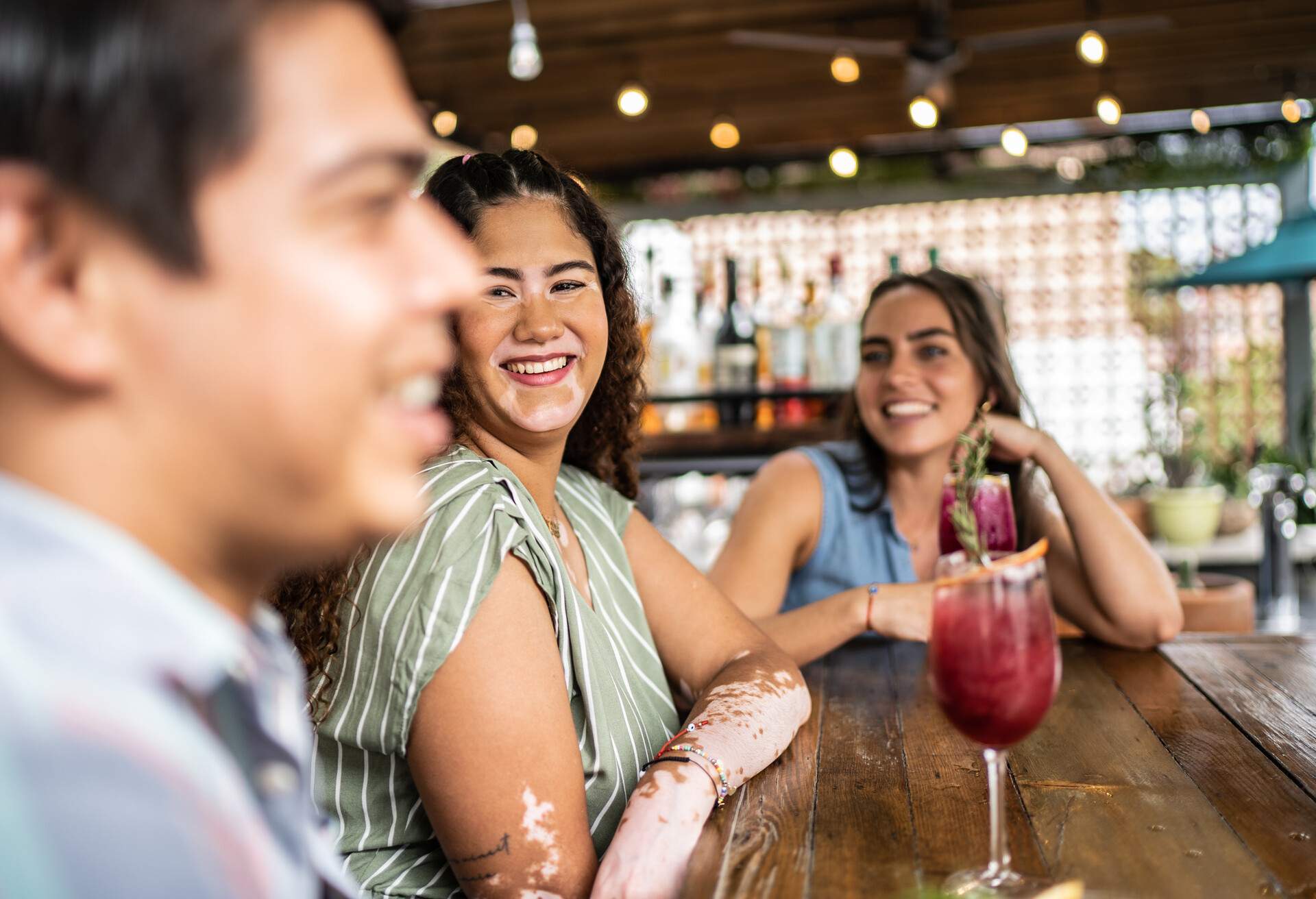 Friends having fun drinking at pub