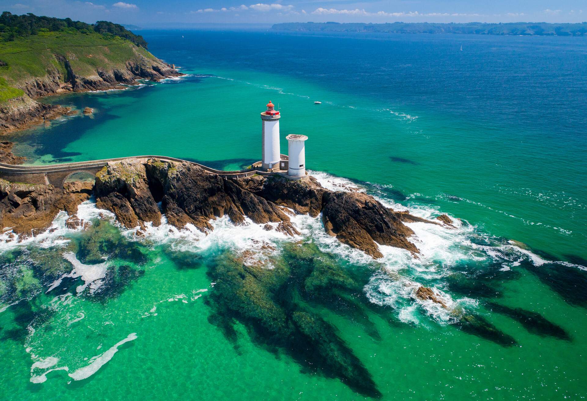 This aerial image was taken in Finistère with a drone in Brest, Bretagne. The colors of the sea are fantastic and really attractive for tourists..You can see lighthouse, waves, and impressive colors of waters..This is really graphical.