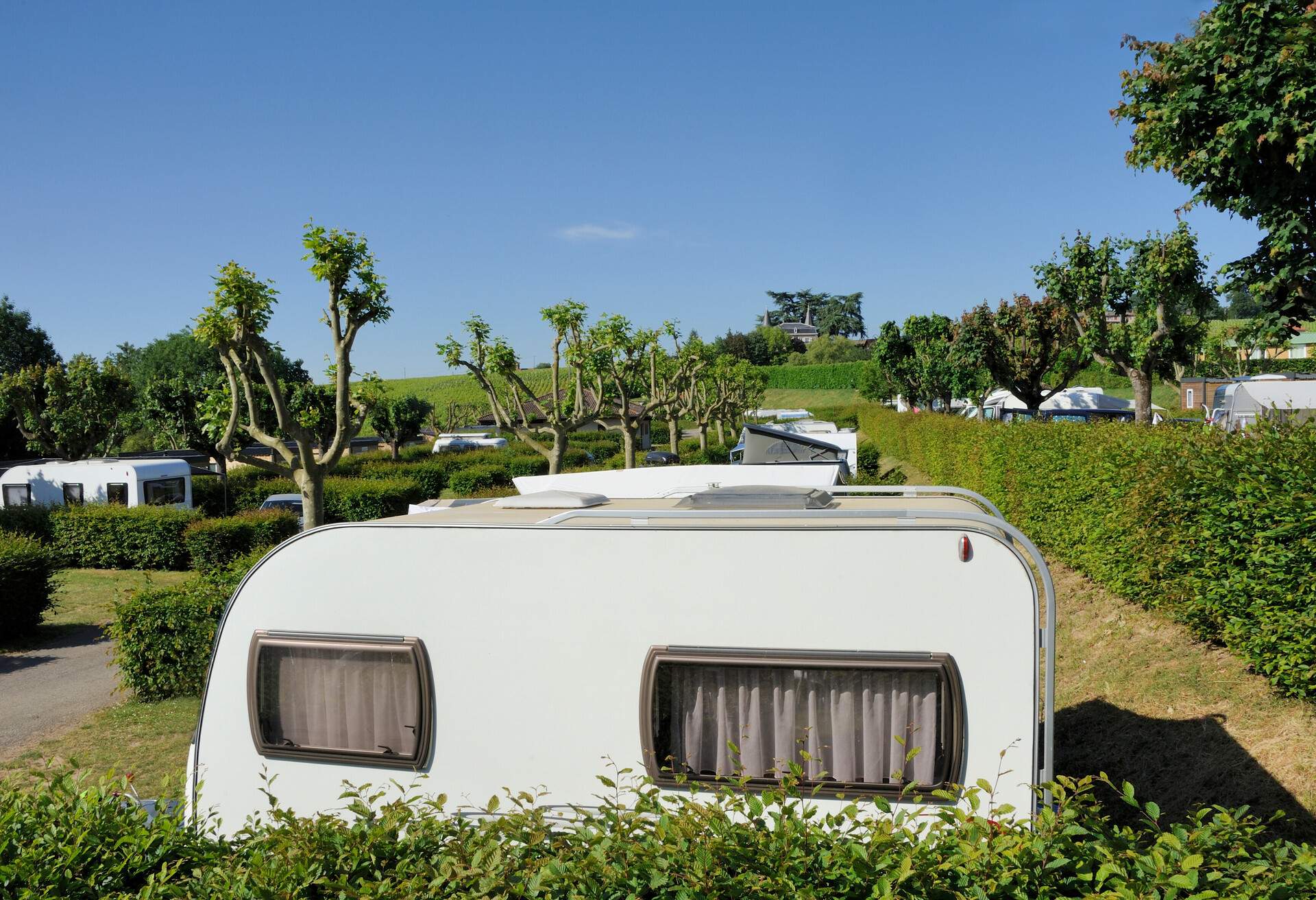 Camping site in France with a castle at the background