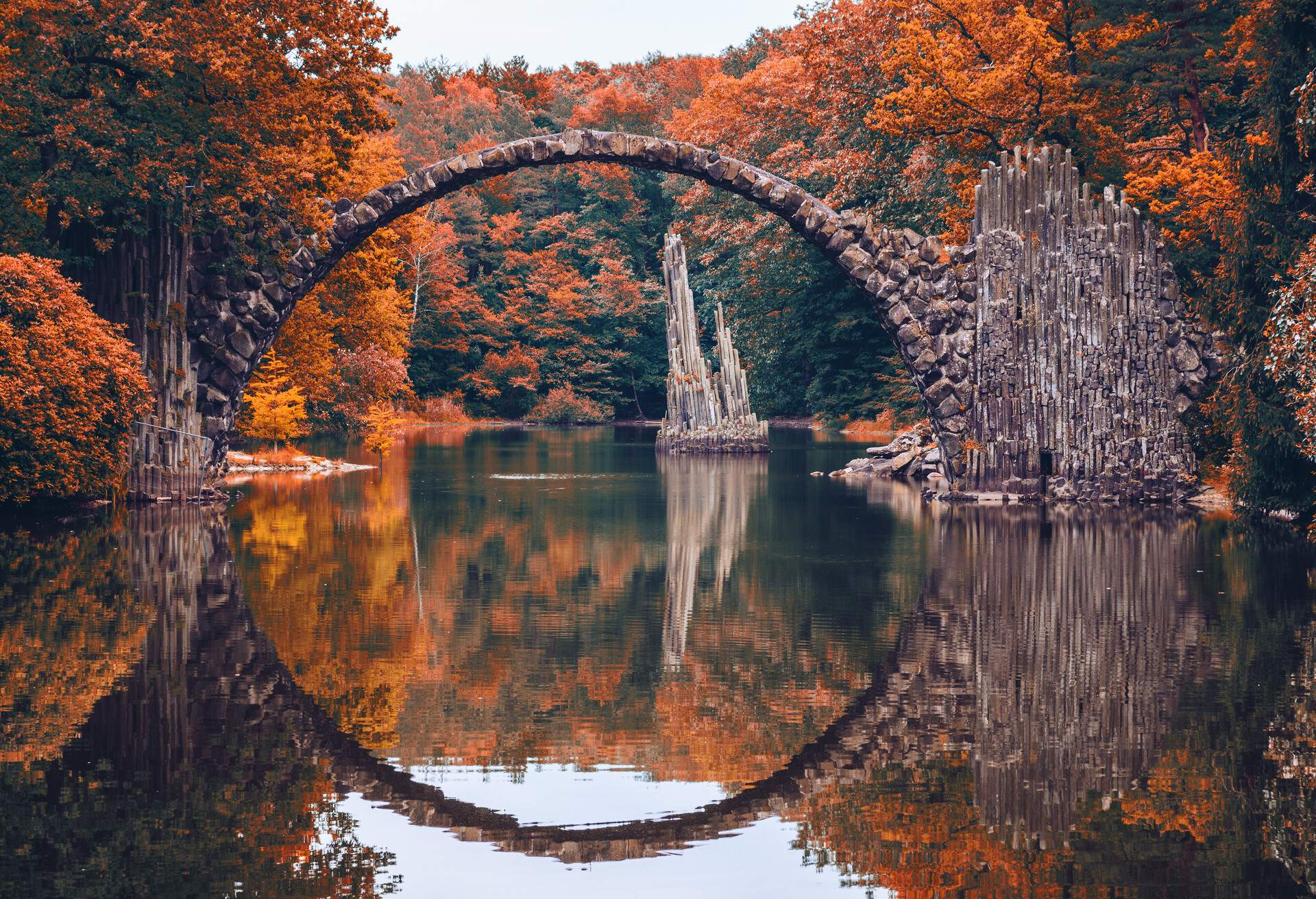 Rakotz Bridge (Rakotzbrucke, Devil's Bridge) in Kromlau, Saxony, Germany. Colorful autumn, reflection of the bridge in the water create a full circle; Shutterstock ID 758202754; Purchase Order: SF-06928905; Job: ; Client/Licensee: ; Other: