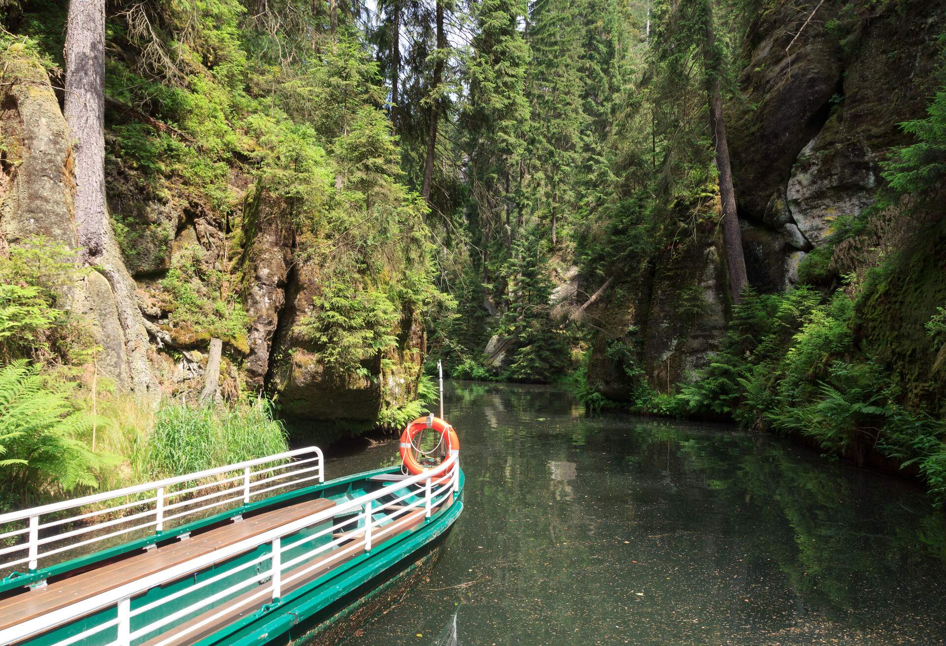 Boat at barrage Obere Schleuse on river Kirnitzsch in Hinterhermsdorf, Saxon Switzerland