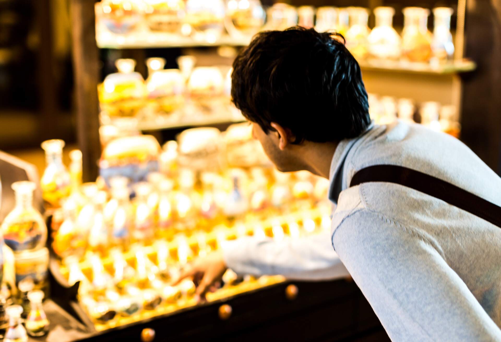 Young Tourist Choosing Souvenirs from a traditional local market also known as Souq.