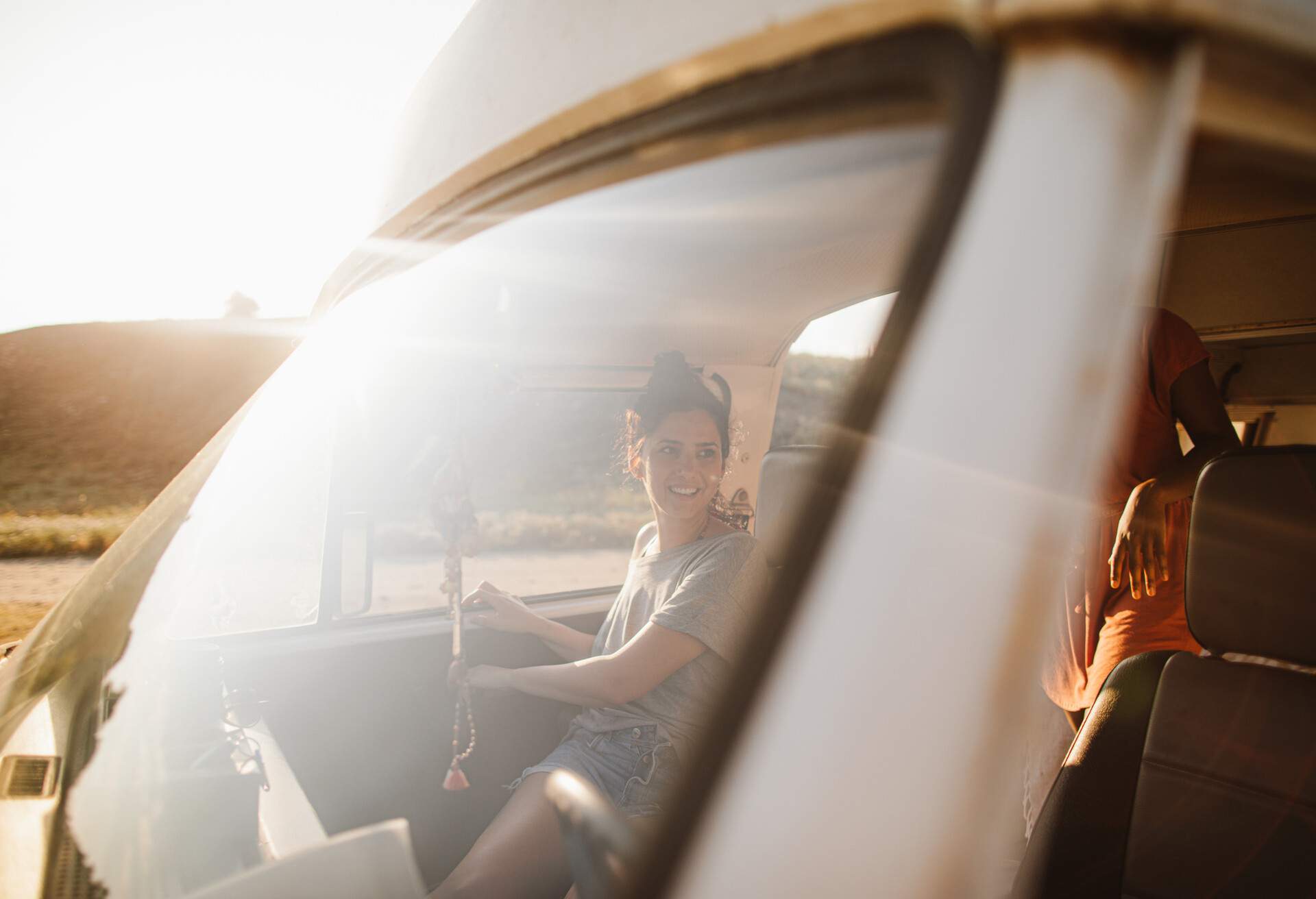 Photo of girlfriends on a summer road trip with of their mini van