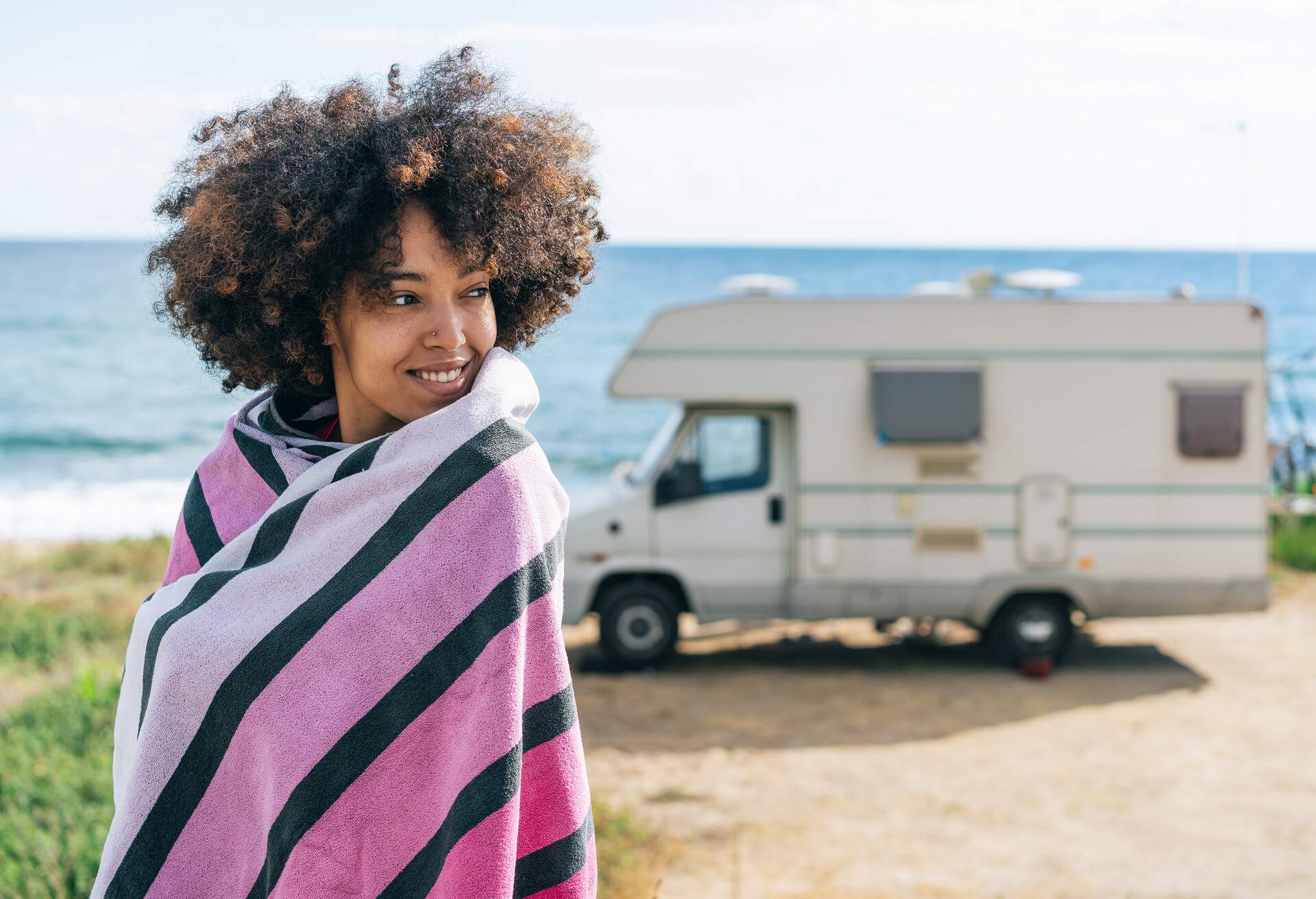 THEME_PEOPLE_WOMAN_CAMPING_CAMPERVAN_BEACH_SEA_GettyImages