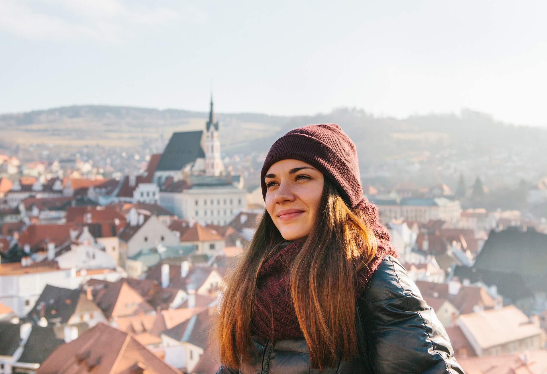 Portrait of a tourist girl who visits the sights in Cesky Krumlov in the Czech Republic in winter.; Shutterstock ID 1238885062