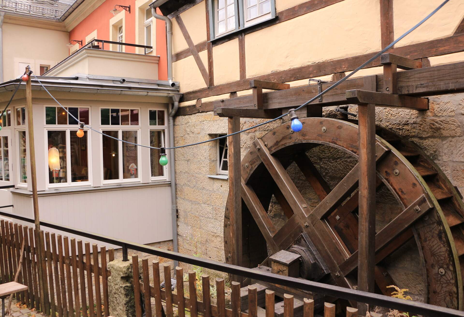 Oktober 22, 2021, Bad Schandau-Schmilka: Historic building with wooden water wheel in the center of Schmilka in Saxon Switzerland