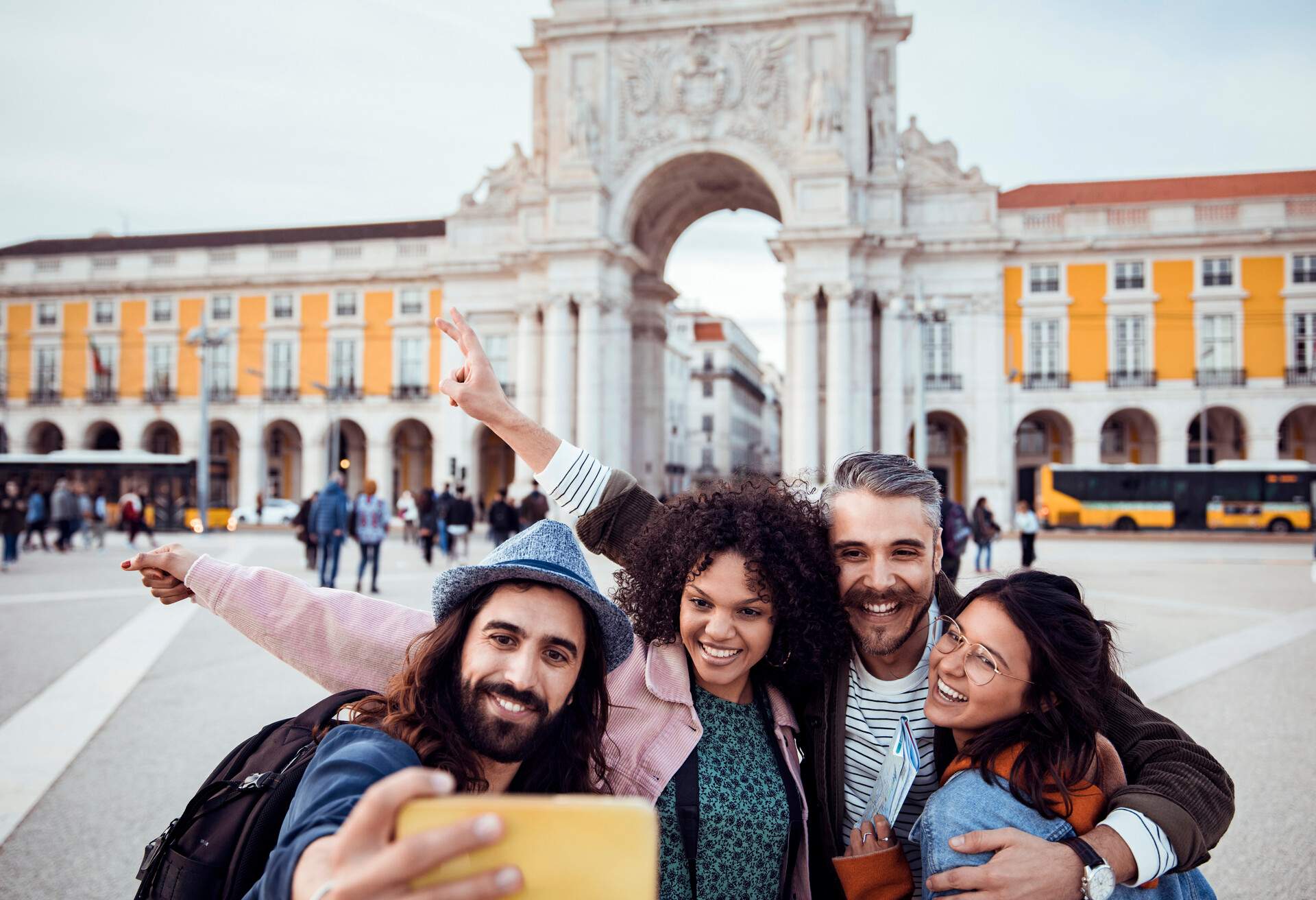 Close up of a group of friends exploring Lisbon and the Arco do Triunfo da Rua Augusta