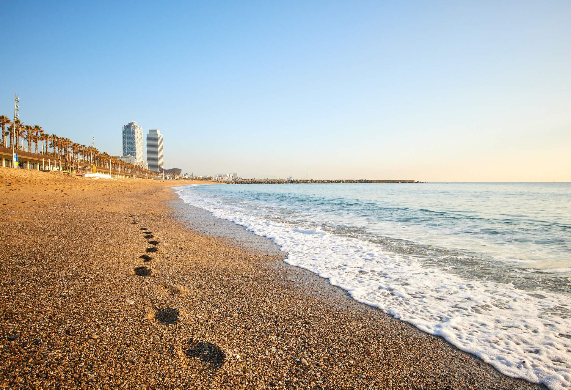 Footprints at the beach of Barceloneta in Barcelona, Spain