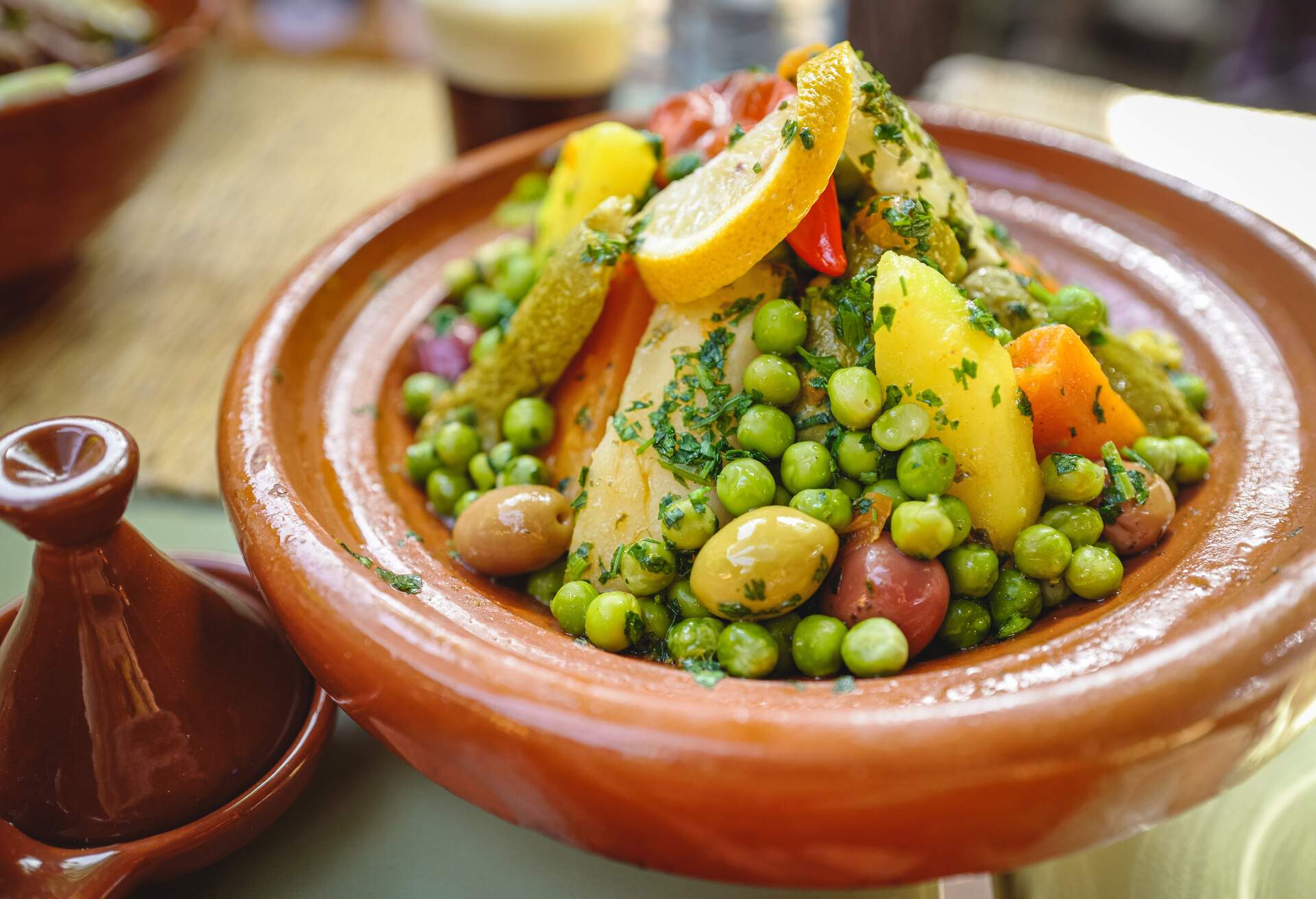 Close-up view of vegetables prepared in traditional Moroccan food Tajine, a Maghrebi dish named after the earthenware pot in which it is cooked. Morocco, North Africa.