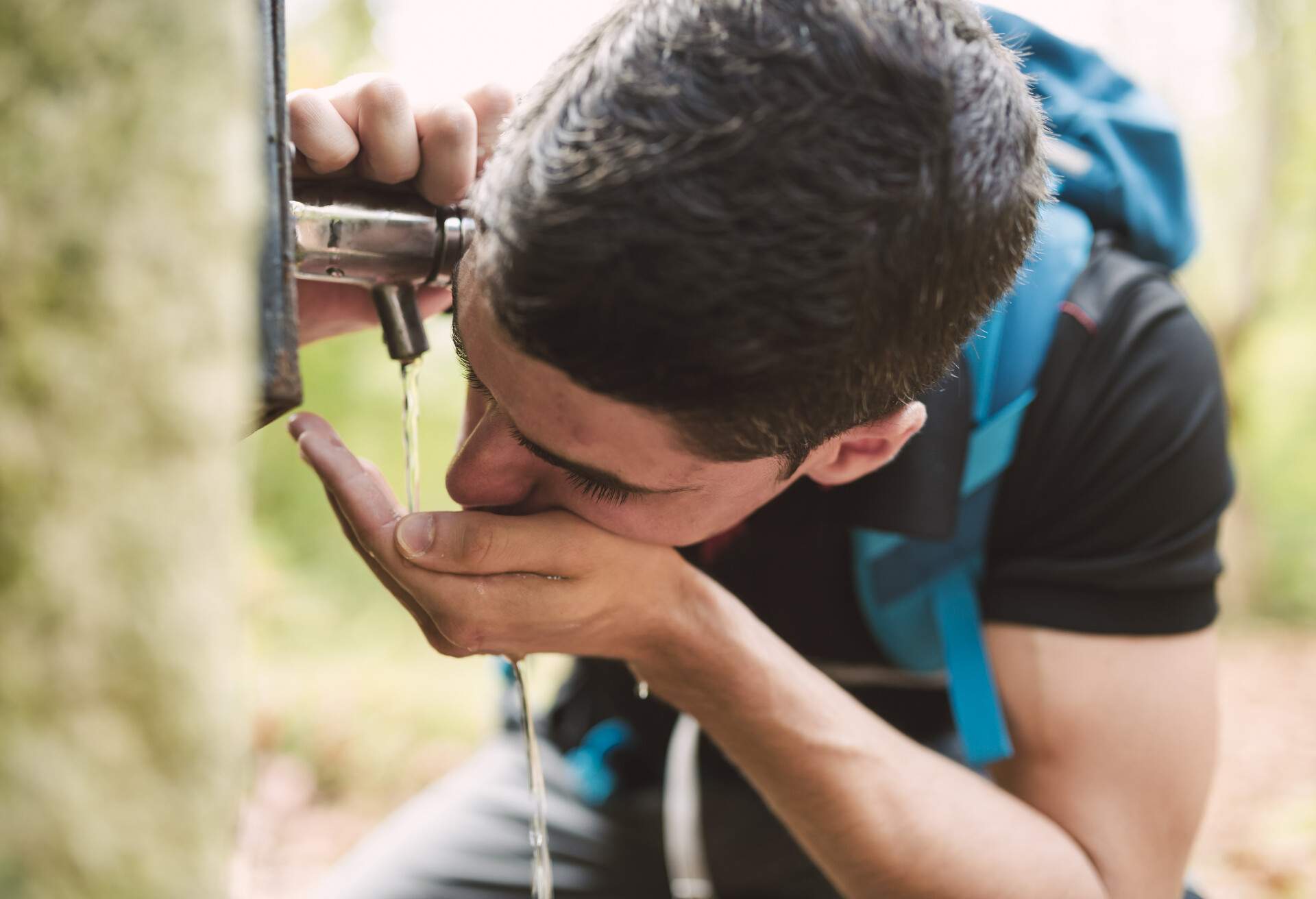 people_man_hike_water_drinking_well