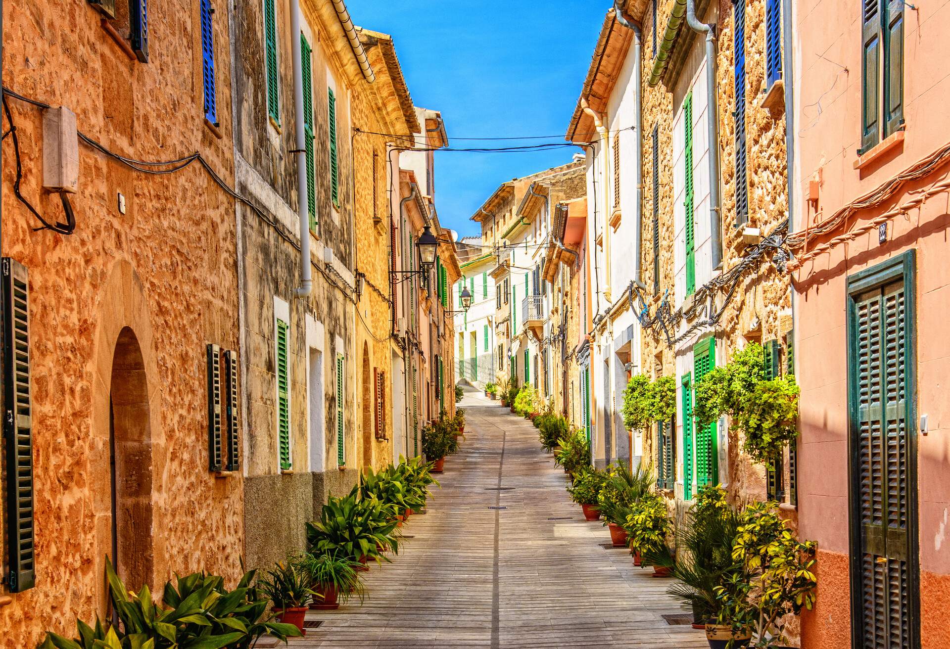 Beautiful street with traditional majorcian houses in the town of Alcudia, Majorca (Spain).
