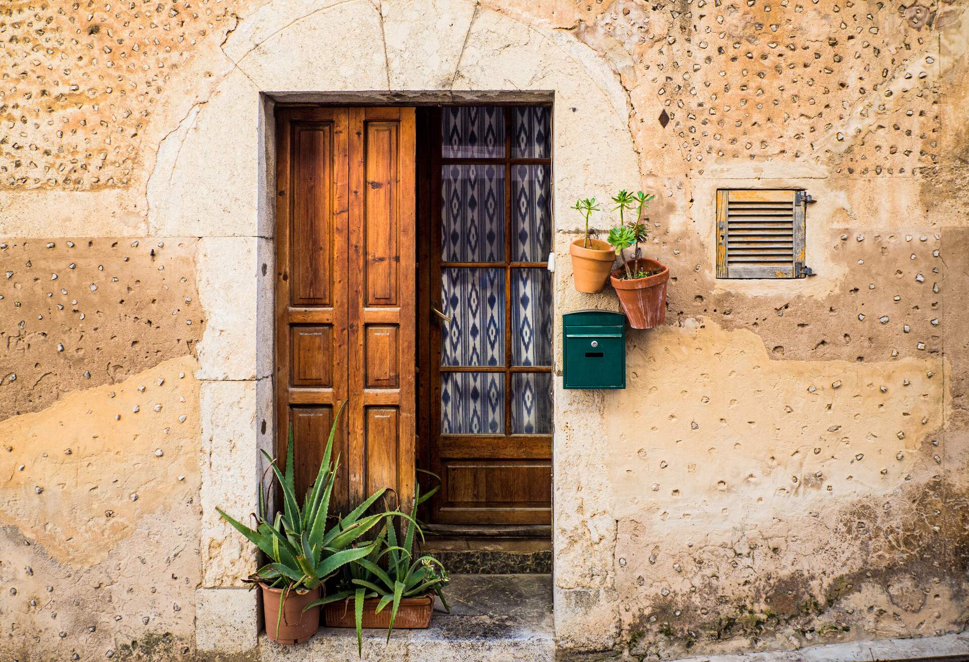 The picture shows a traditionally decorated window of one of the residential buildings in the village of Valldemossa. Valldemossa is an old mediterranean village, landmark of Mallorca, Spain island