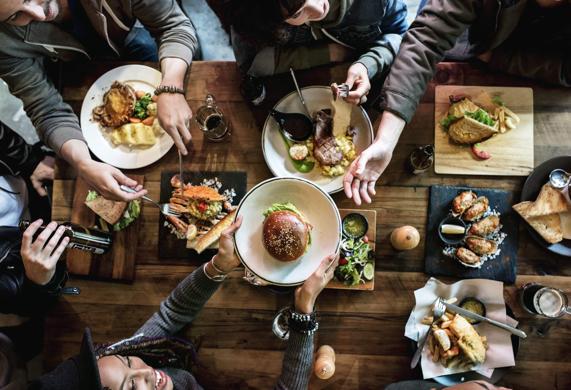 Friends all together at restaurant having meal