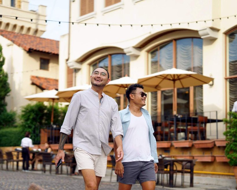 PEOPLE_MEN_COUPLE_GAY_HOLDING_HANDS_WALKING_RESTAURANT_BAR_CROPPED