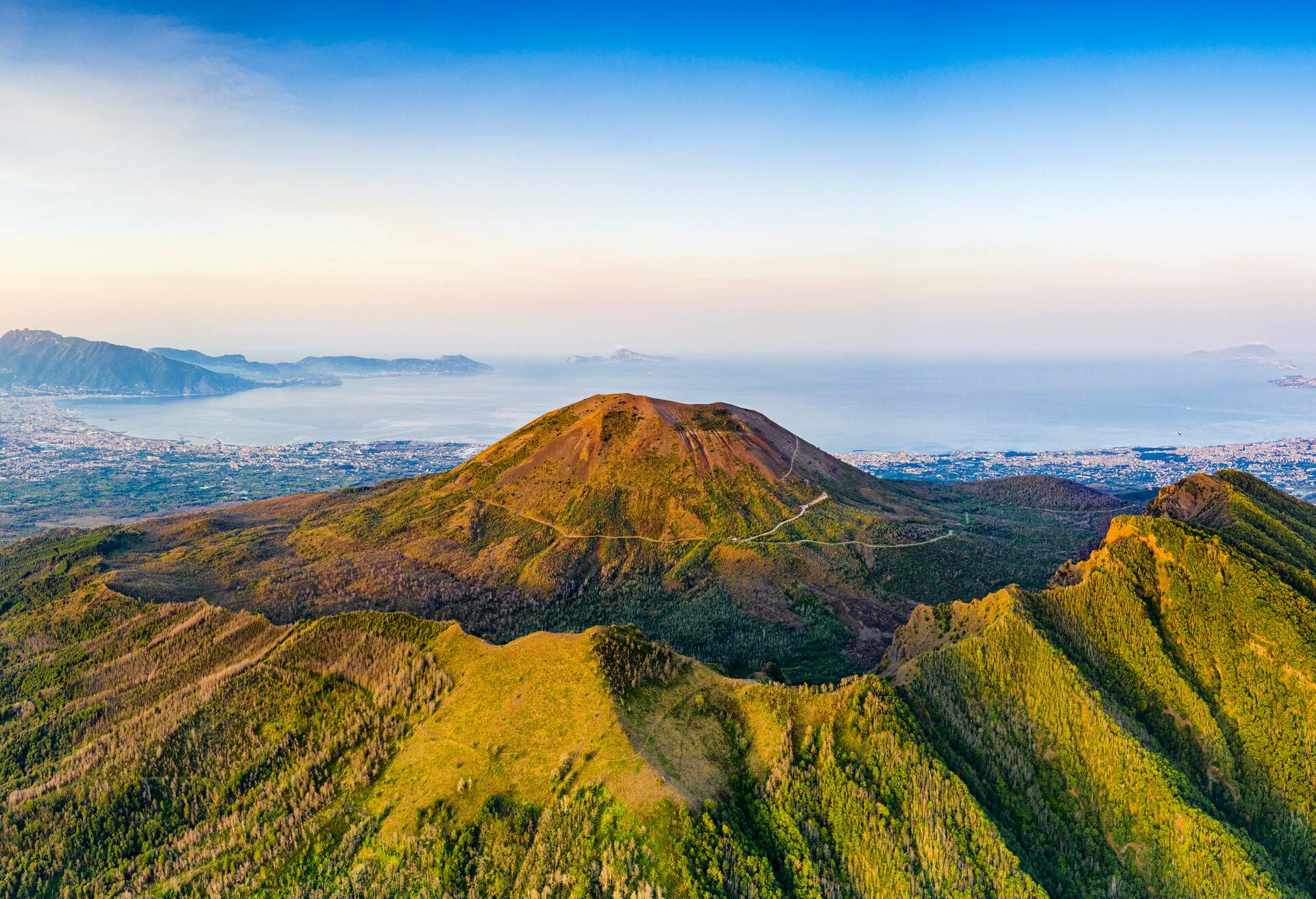 Aerial view of sunrise over Mount Vesuvius volcano and Naples in summer, aerial view, Naples, Campania, Italy