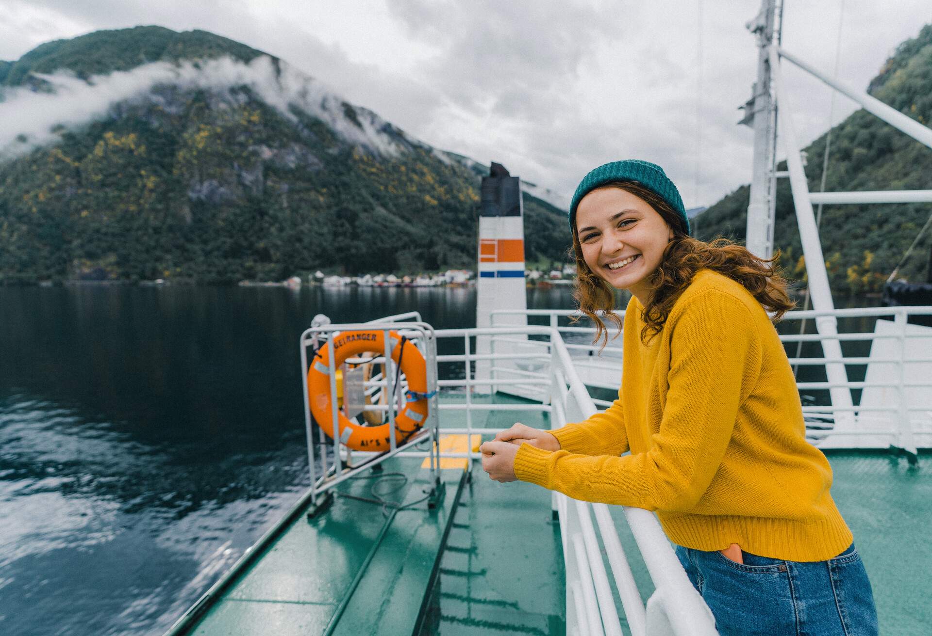 Young Caucasian woman traveling by ferry in Norway