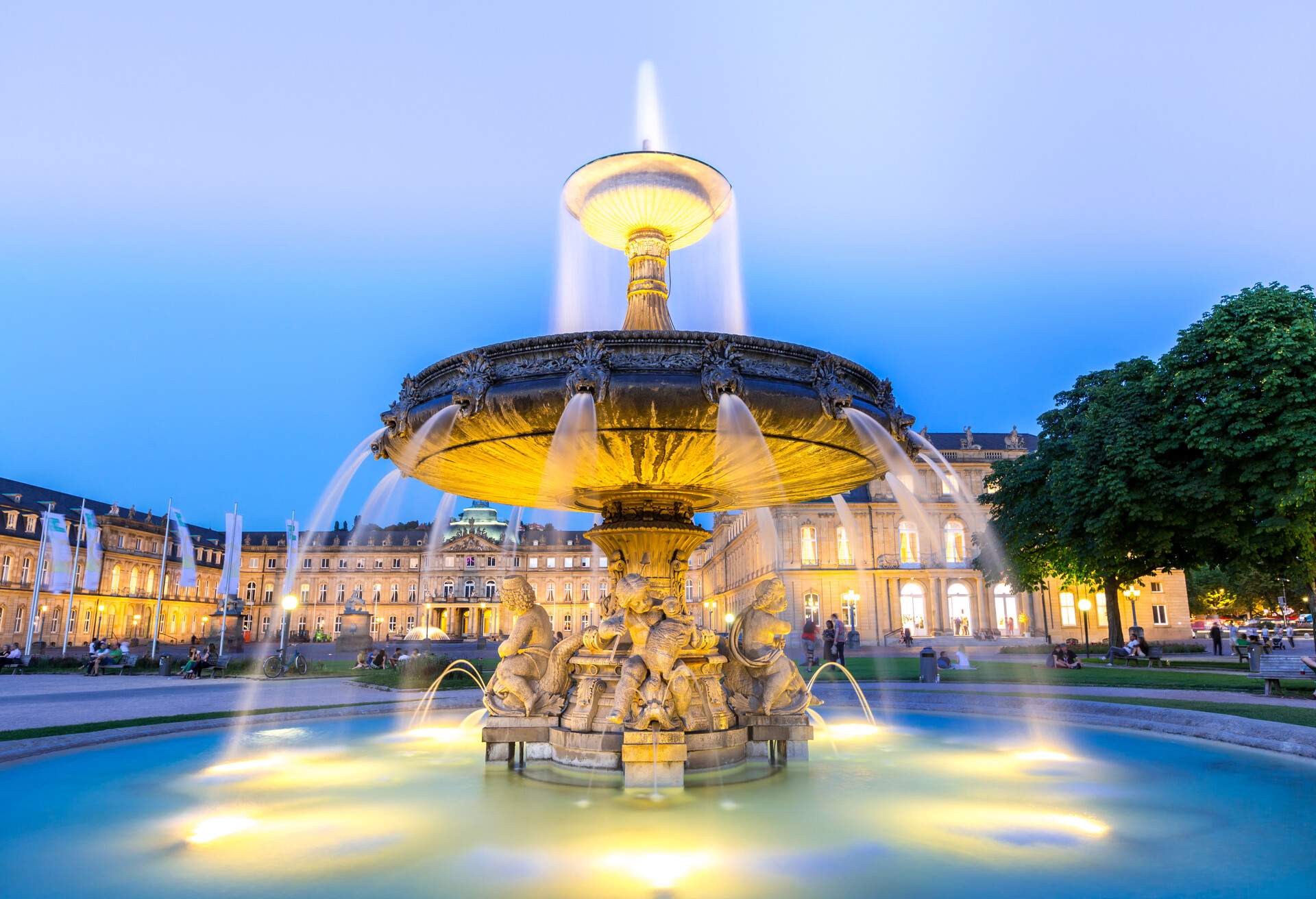 Fountain at neues Schloss New palace in Stuttgart city center, Germany at dusk